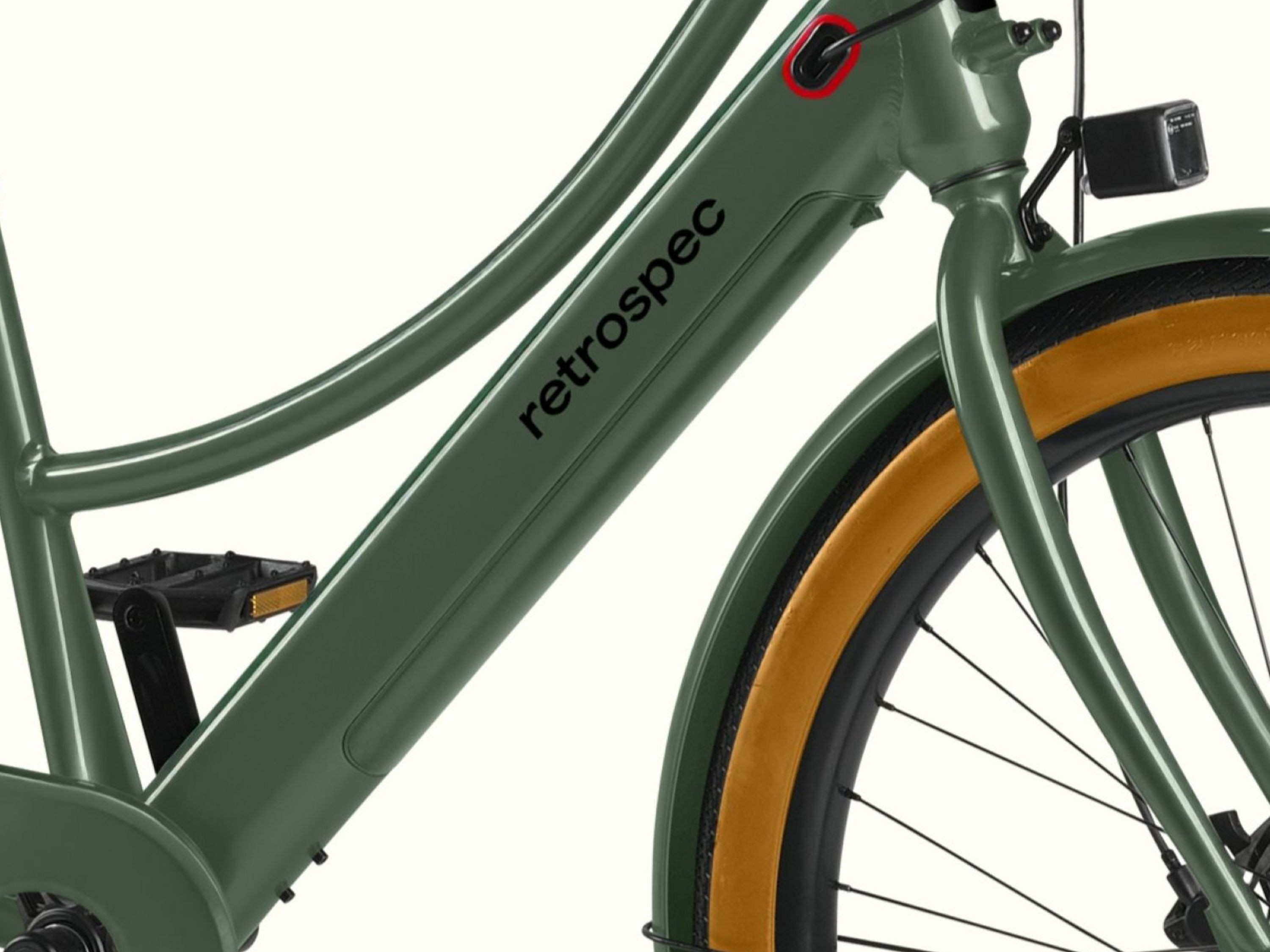 A closeup of the battery on the Beaumont Rev+ City Electric Step Through Bike's frame with featured 'retrospec logo'.