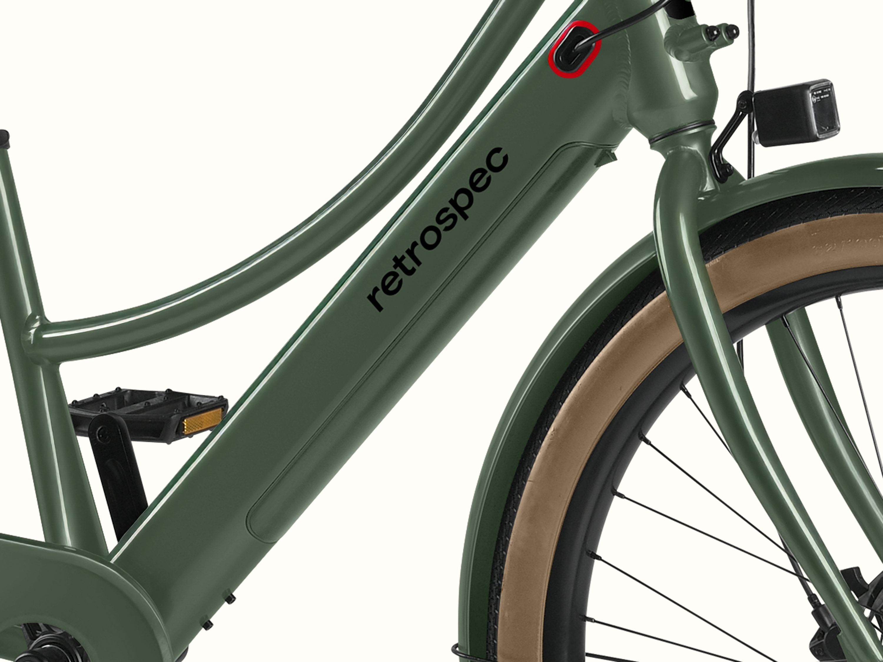 A closeup of the battery on the Beaumont Rev+ City Electric Step Through Bike's frame with featured 'retrospec logo'.