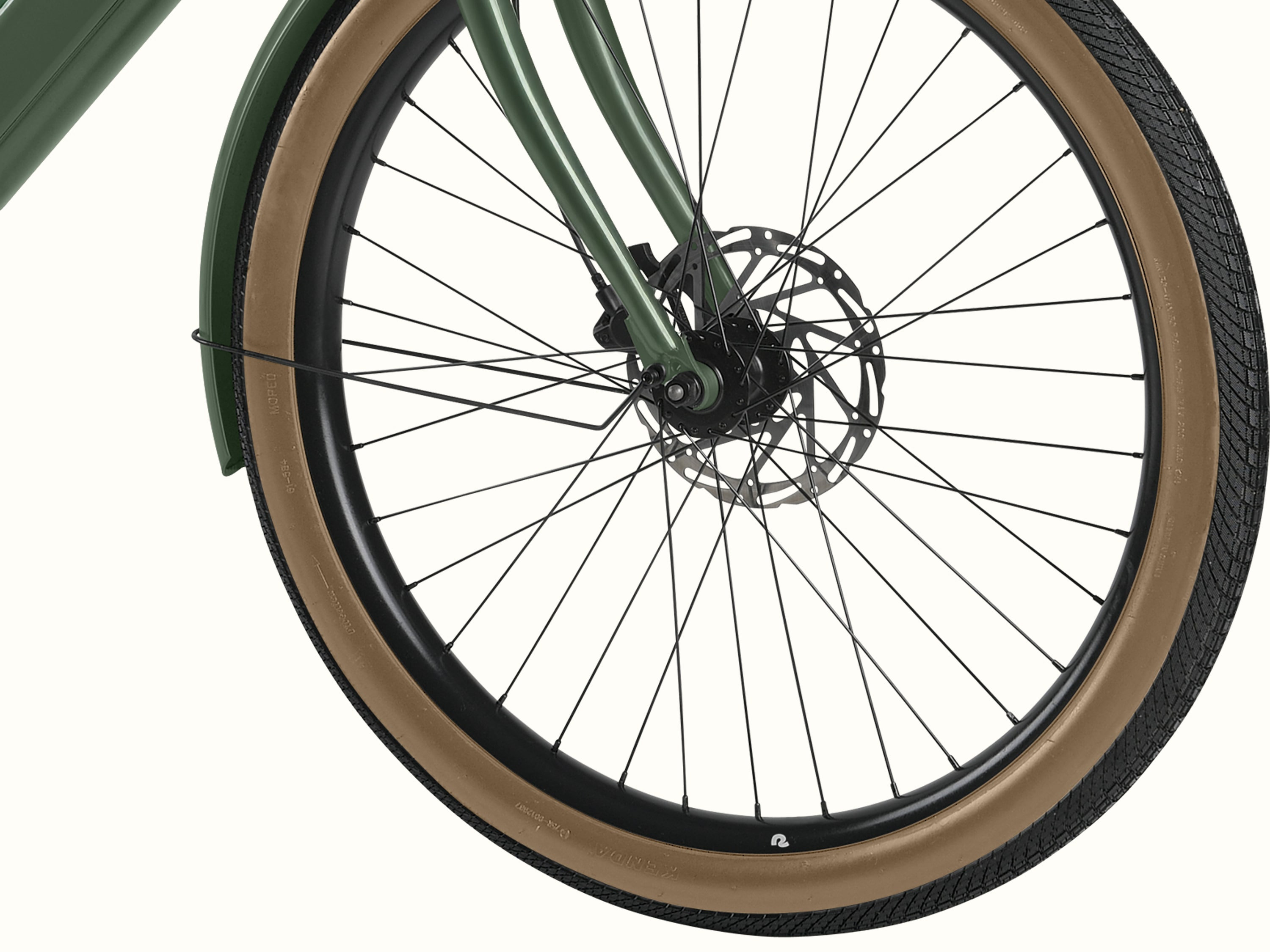 A close up of the wheel on the Beaumont Rev+ EBike on a white background.