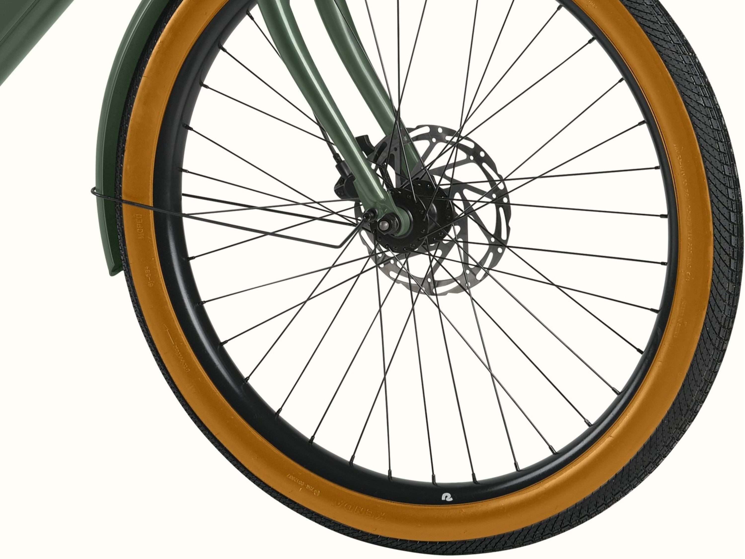 A close up of the wheel on the Beaumont Rev+ EBike on a white background.