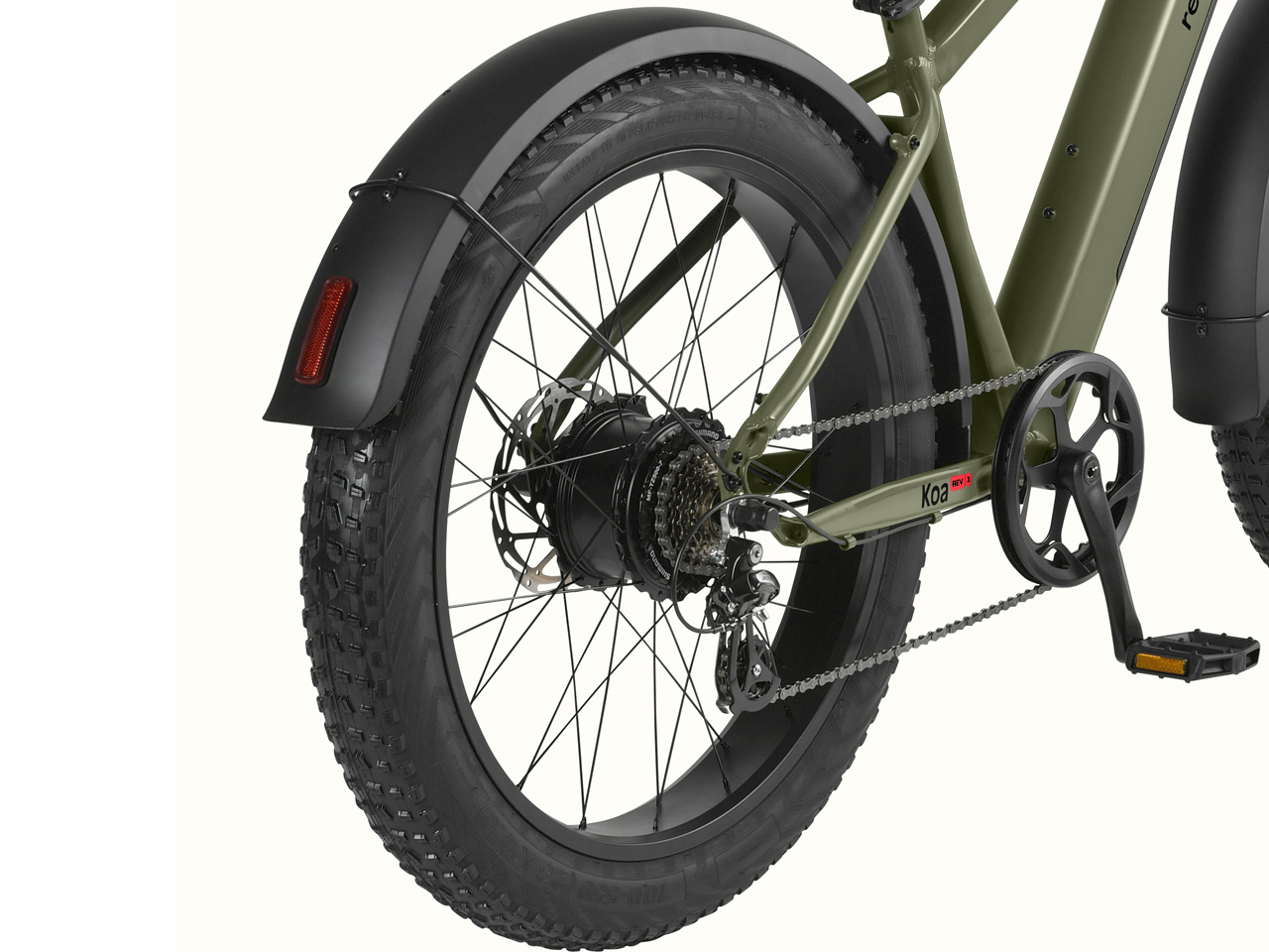 Close-up of a green Koa Rev 3 Fat Tire Electric Bike's rear wheel, featuring a robust fat tire, chain, derailleur, and fender.