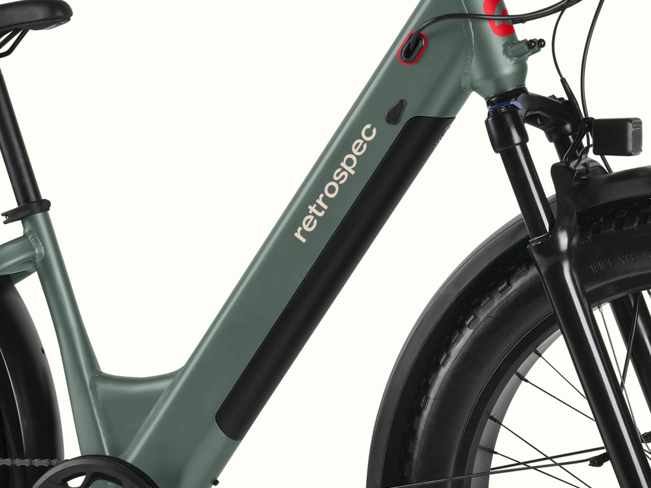 Close-up of the Koa Rev 3 Fat Tire Electric Bike's frame with the integrated battery, featuring a green color and the 