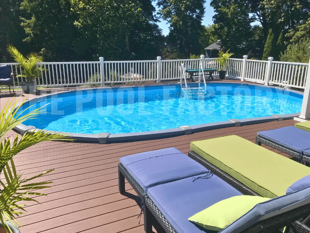 Oval saltwater above ground pool with sleek Trex deck chic sun loungers