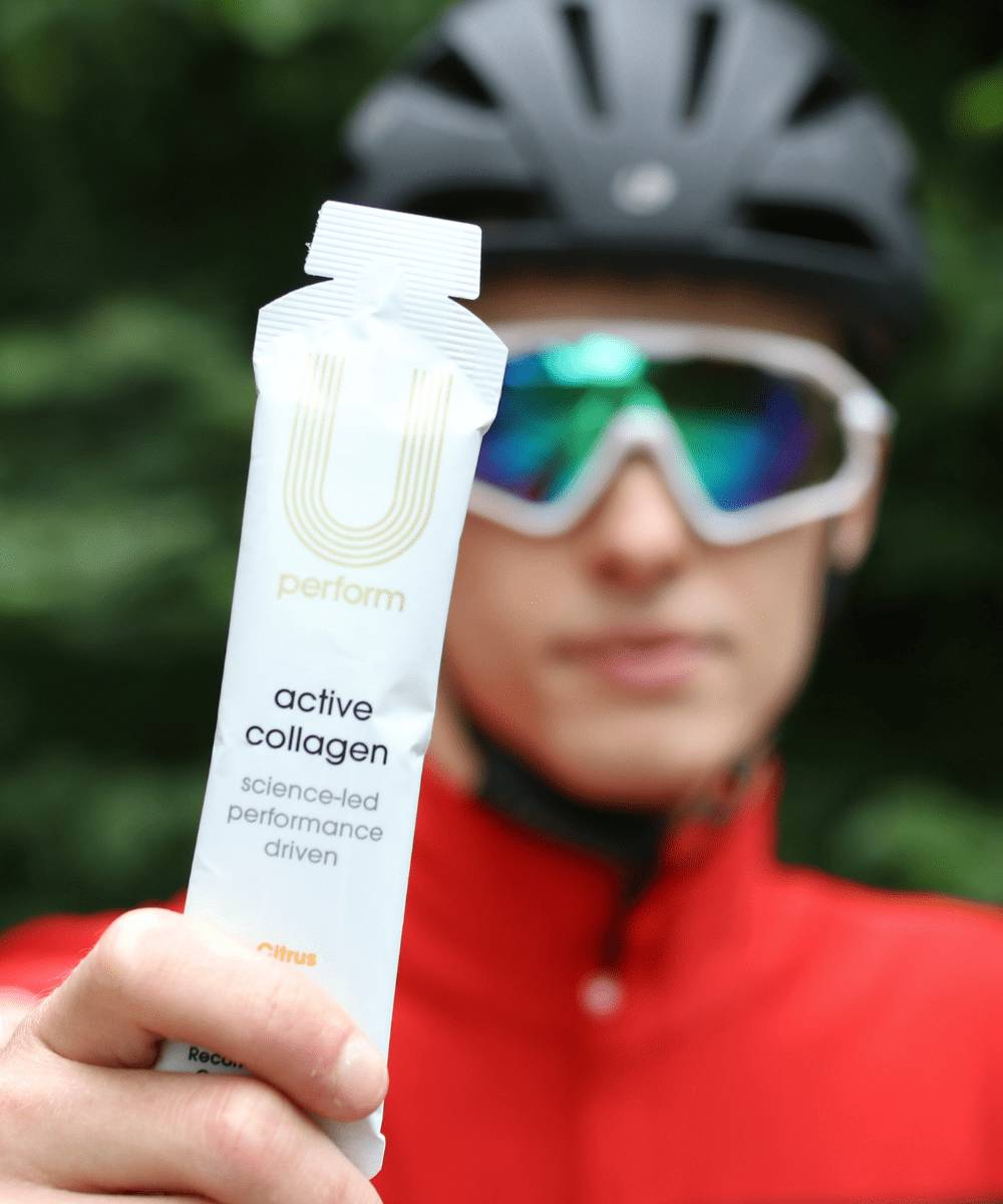 U Perform Active Collagen is the No.1 Sports Collagen Supplement in the UK and is proven to improve recovery from exercise and injury, pictured here in the hands of a cyclist