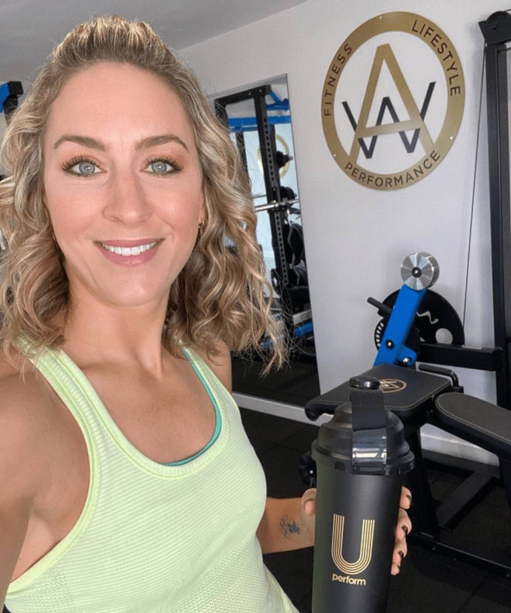 Active Whey & Collagen is the post-workout recovery supplement of choice of Amy Williams MBE OLY, Olympic Champion, Personal Trainer, Motivational Speaker. She is pictured here in an at-home personal training gym studio holding a U Perform shaker bottle