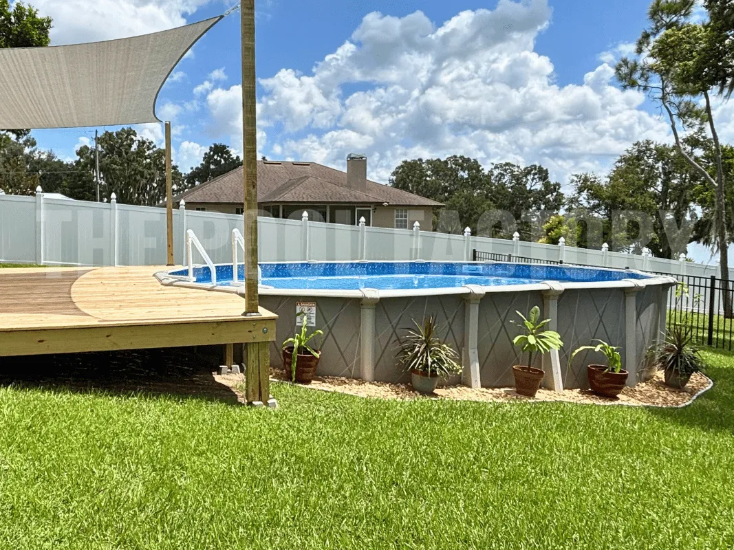 Saltwater 5000 Lazer Oval Pool surrounded by colorful flowers and garden plants.
