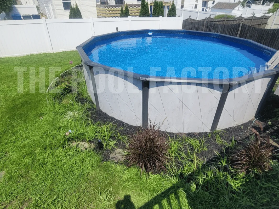Del Rey round above ground swimming pool surrounded by lush green grass on a sunny day.