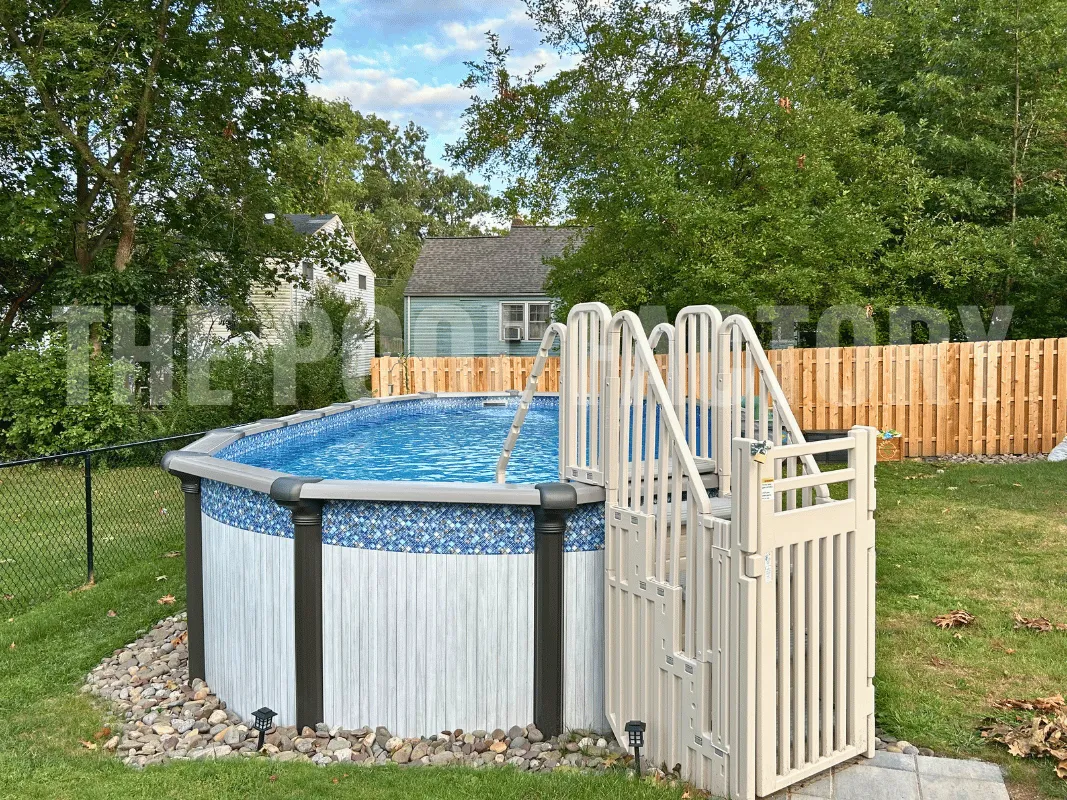 Saltwater Titan Oval Pool with Confer SES Step Enclosure System and landscaping.