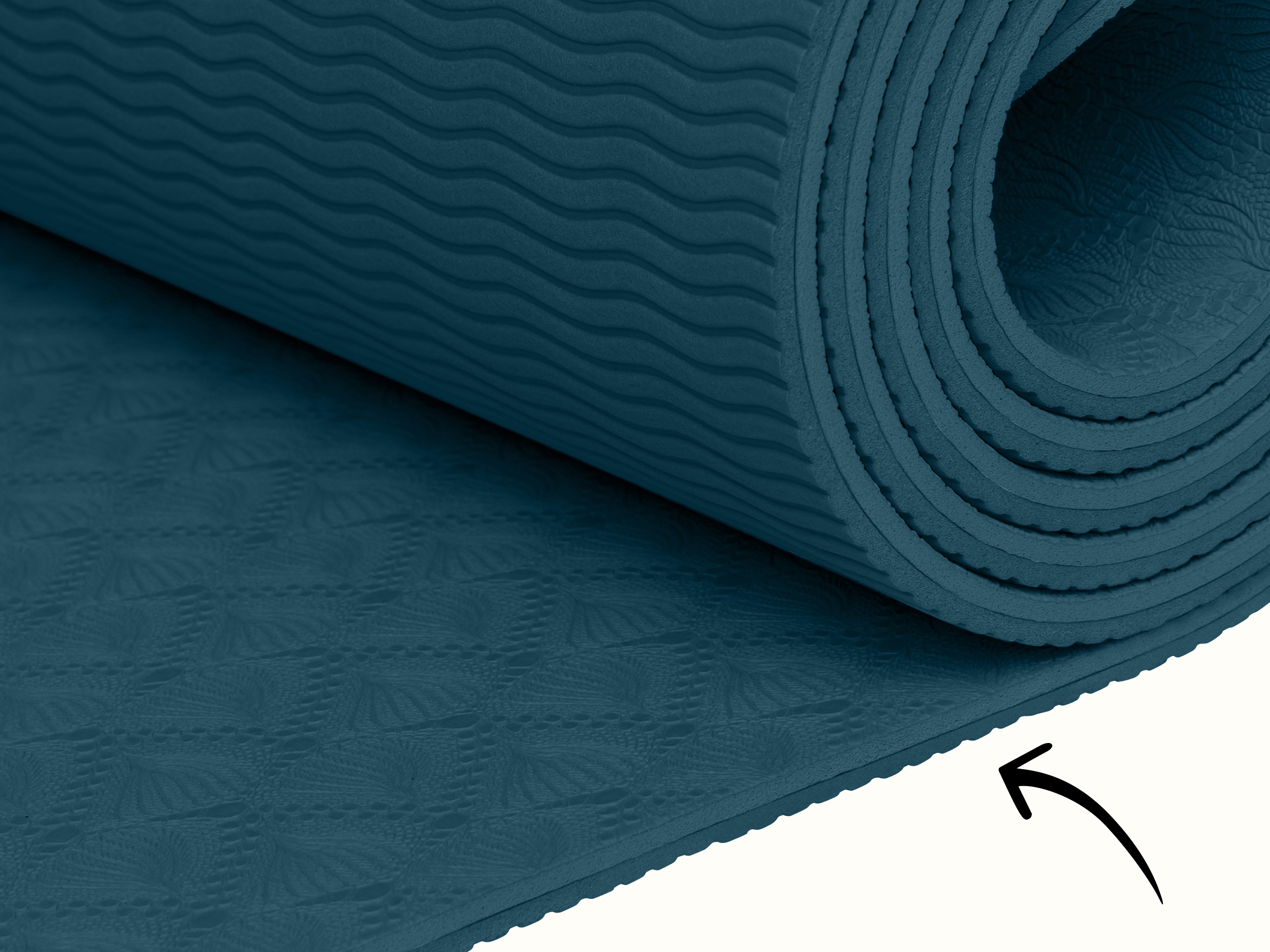 Close-up of the retrospec Zuma Yoga Mat in Ocean Blue, showing the embossed botanical surface texture and cushioned edge detail.