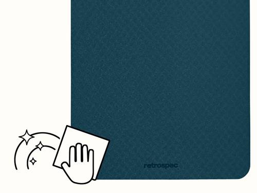 Corner view of the retrospec Zuma Yoga Mat in Ocean Blue with an easy-clean icon, showing the smooth, wipe-down-friendly top surface and the retrospec logo.