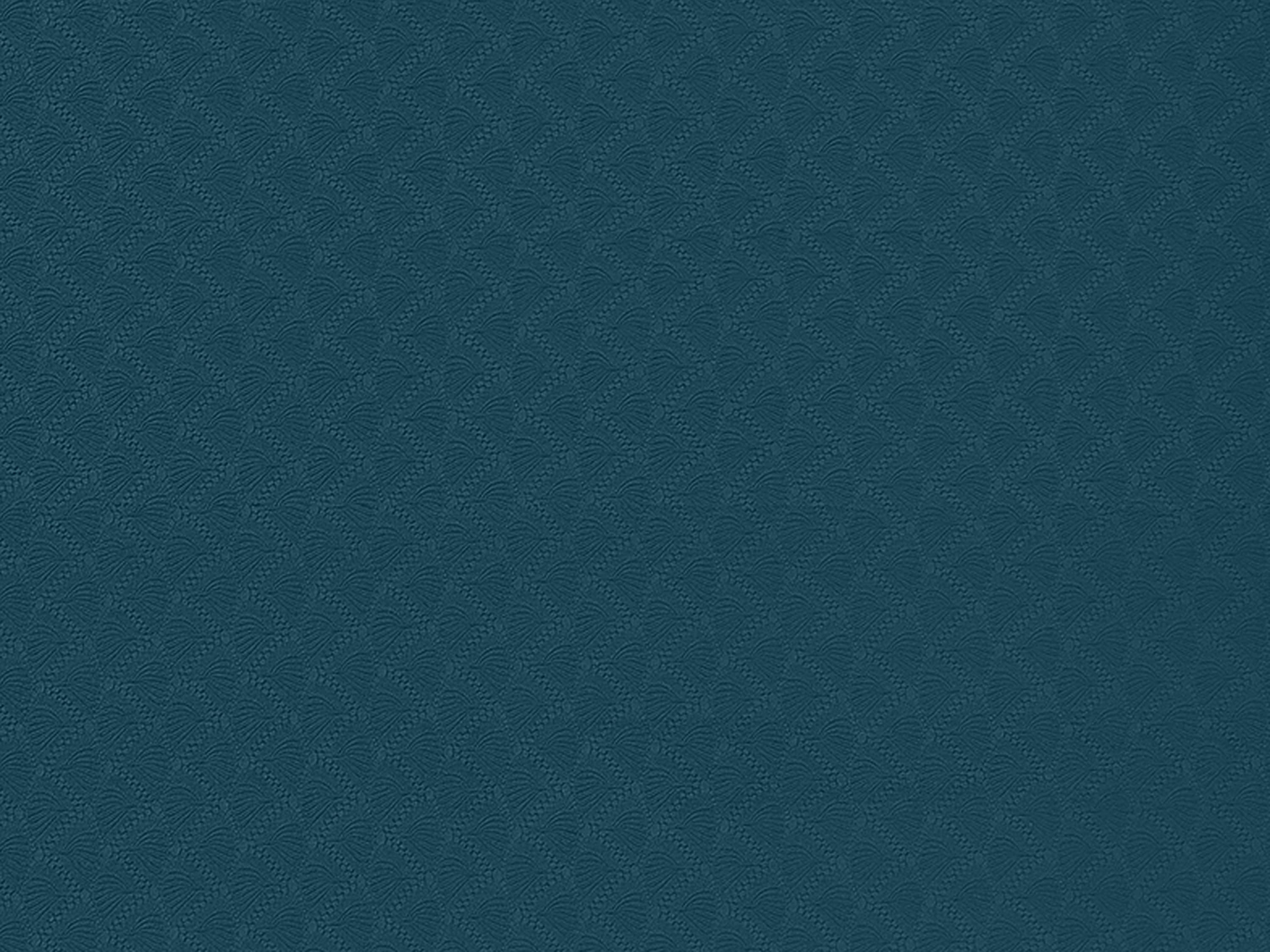 Top-down view of the retrospec Zuma Yoga Mat surface in Ocean Blue, featuring an all-over wave and petal embossed grip pattern.