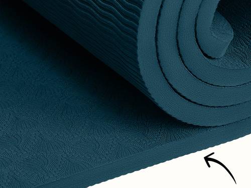 Close-up of the retrospec Zuma Yoga Mat in Ocean Blue, showing the embossed botanical surface texture and cushioned edge detail.