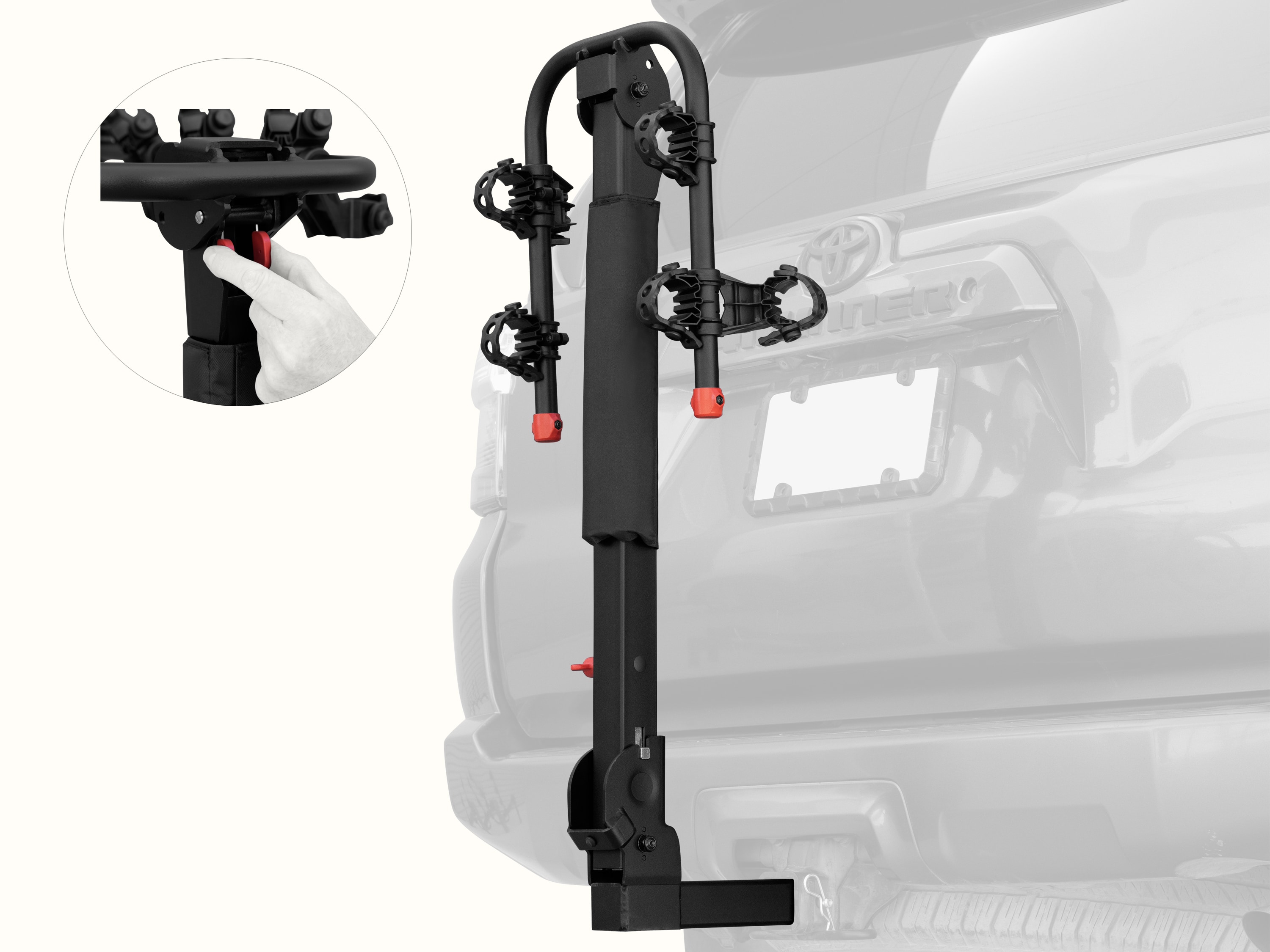 retrospec Lenox Plus Hitch Mount Car Bike Rack (2-4 Bikes) installed on the rear of a Toyota 4Runner, shown empty in the folded upright position with cradle arms raised and red safety caps in place.