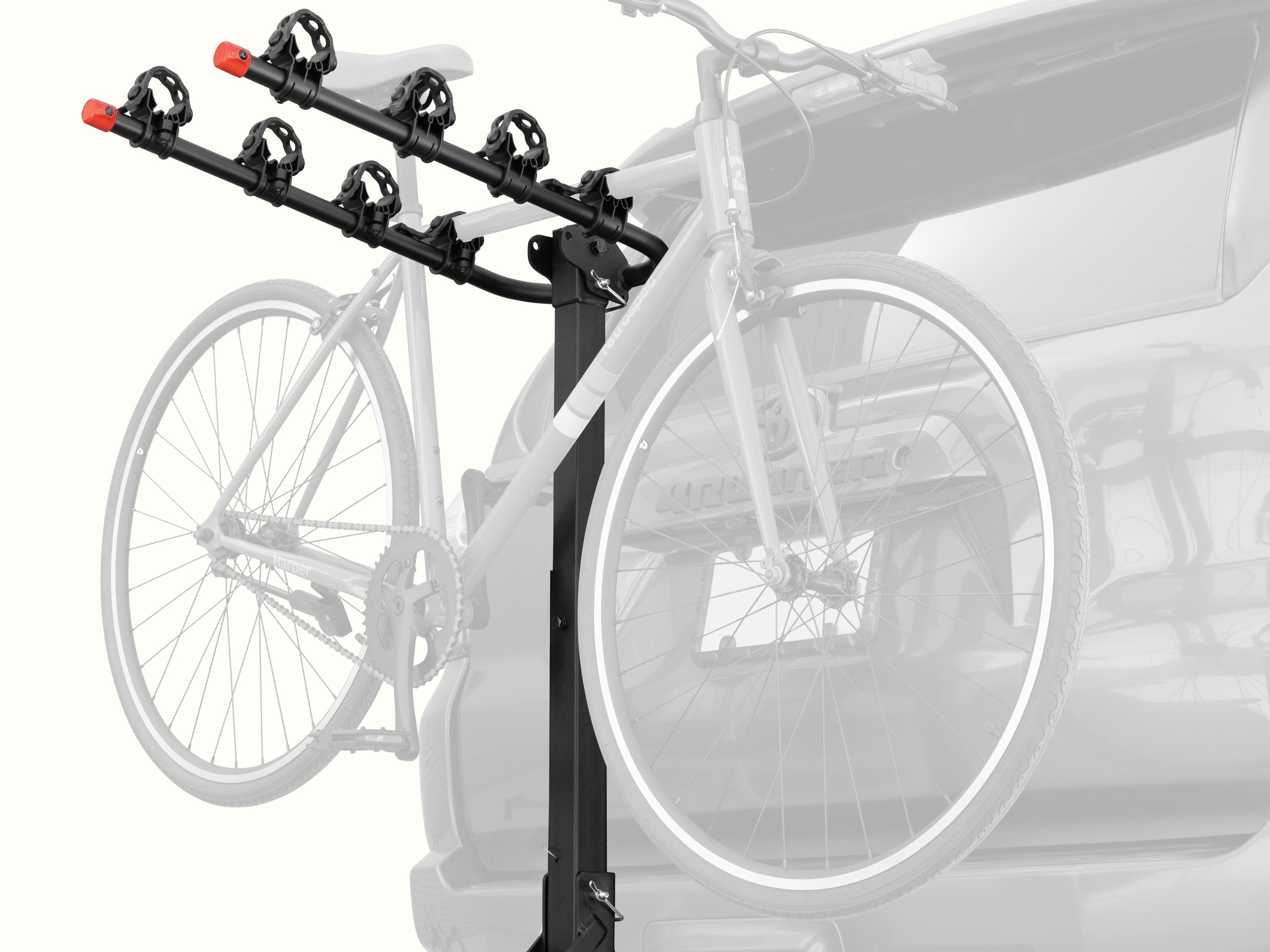 retrospec Lenox Hitch Mount Car Bike Rack (4-Bikes) installed on an SUV with one bike secured in the frame cradles, shown from a rear three-quarter angle.