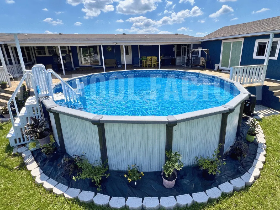 Saltwater Titan Round Pool with surrounding flower bed and deck.