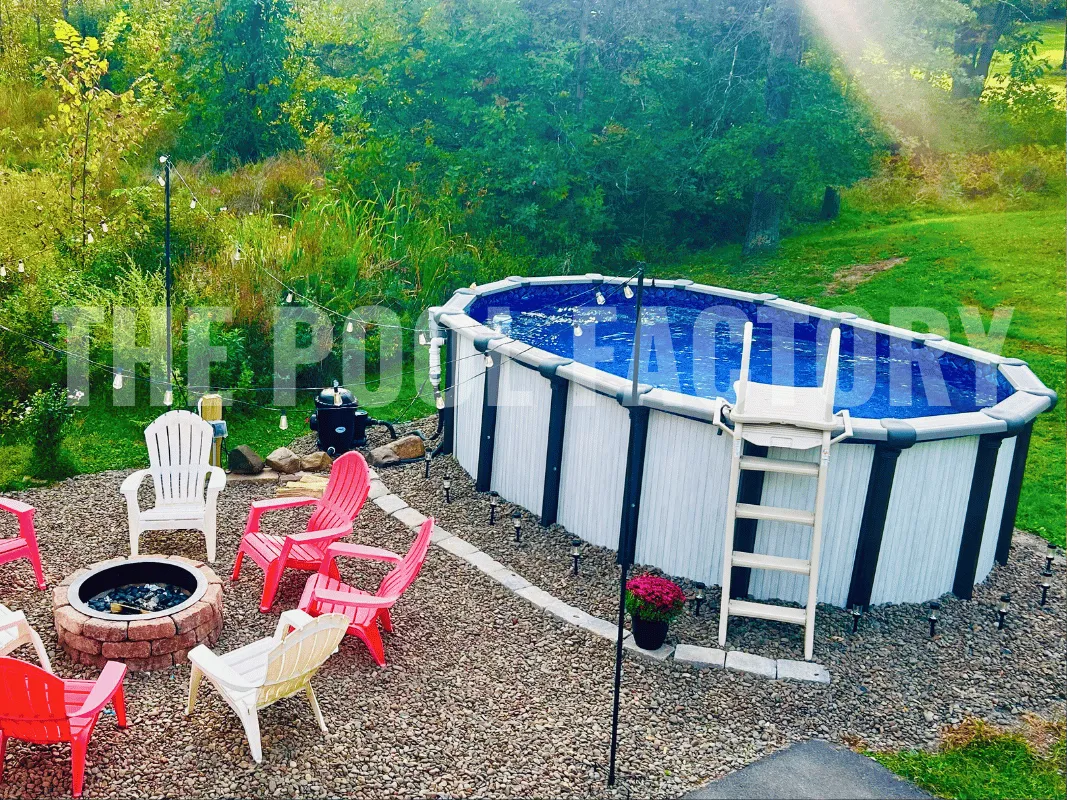 Saltwater Titan Oval Pool with fire pit and chairs.