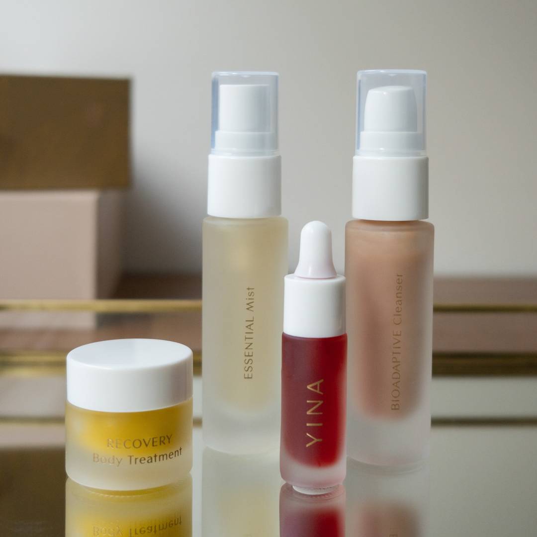 YINA's Mind-body Ritual Set featuring bioadaptive cleanser, essential mist, nourish botanical serum, and recovery body treatment.