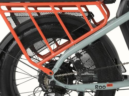 Close-up of the orange rear cargo rack and mesh wheel guard set installed on the retrospec Roo Rev electric cargo bike in mint.
