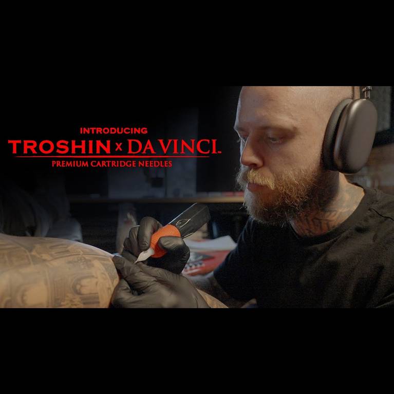 Tattoo artist using a Troshin x Da Vinci cartridge needle.