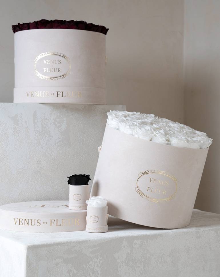 Luxurious suede gift box with white roses inside