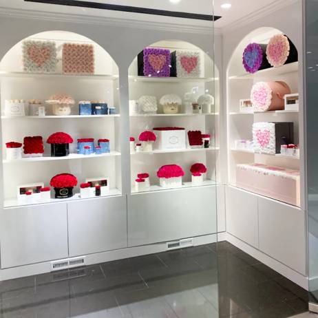 interior of the Venus et Fleur boutique with flower box displays in Americana Manhasset