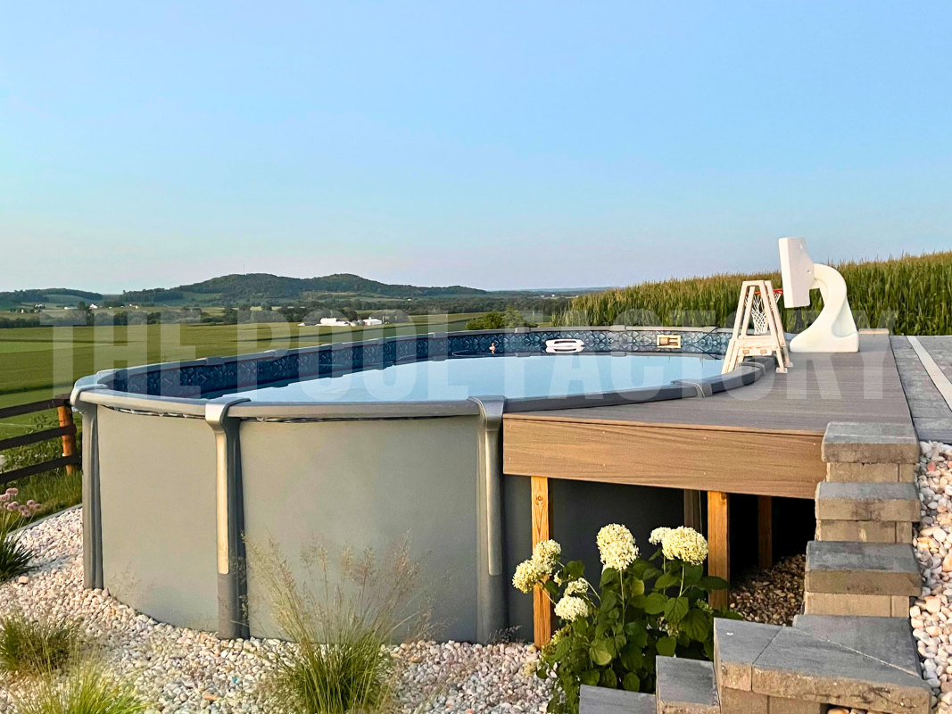 Oval saltwater swimming pool with deck and mountain views