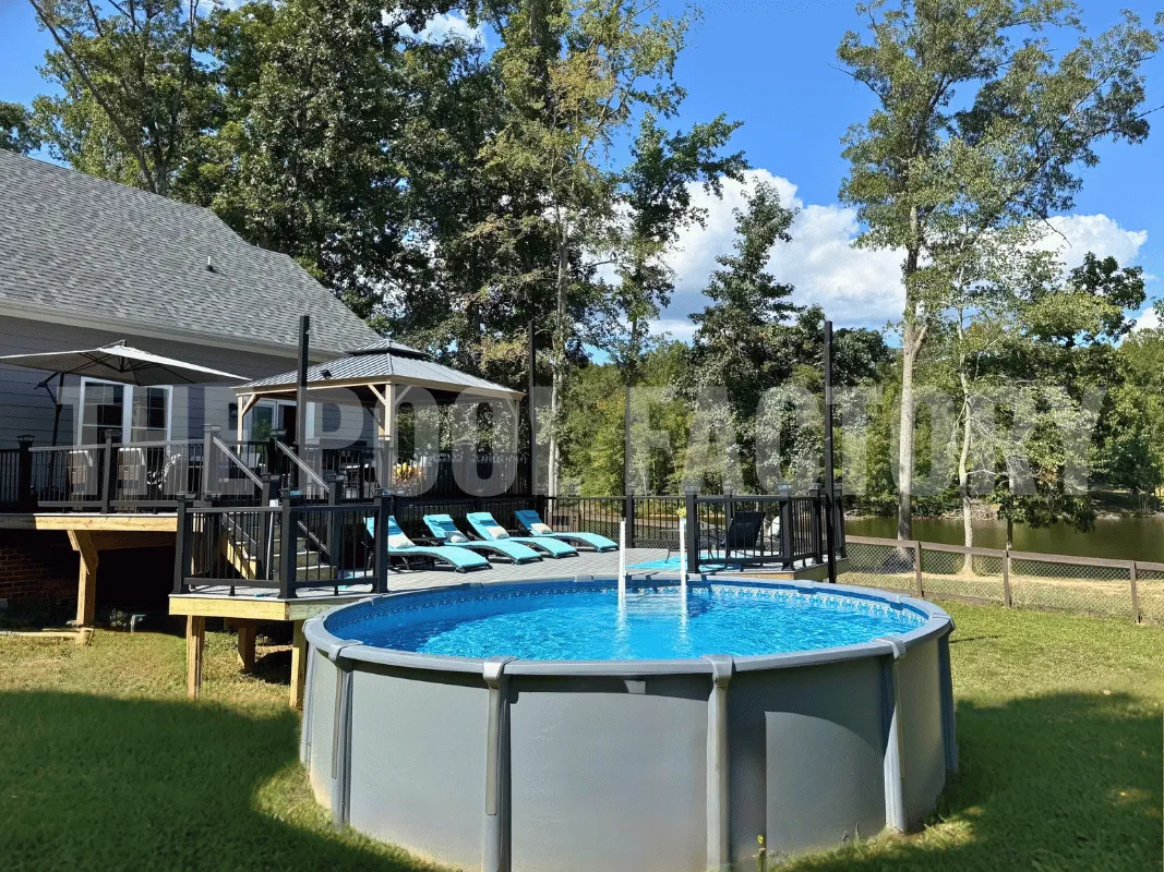 Saltwater above ground pool with elevated platform, patio furniture, and umbrellas