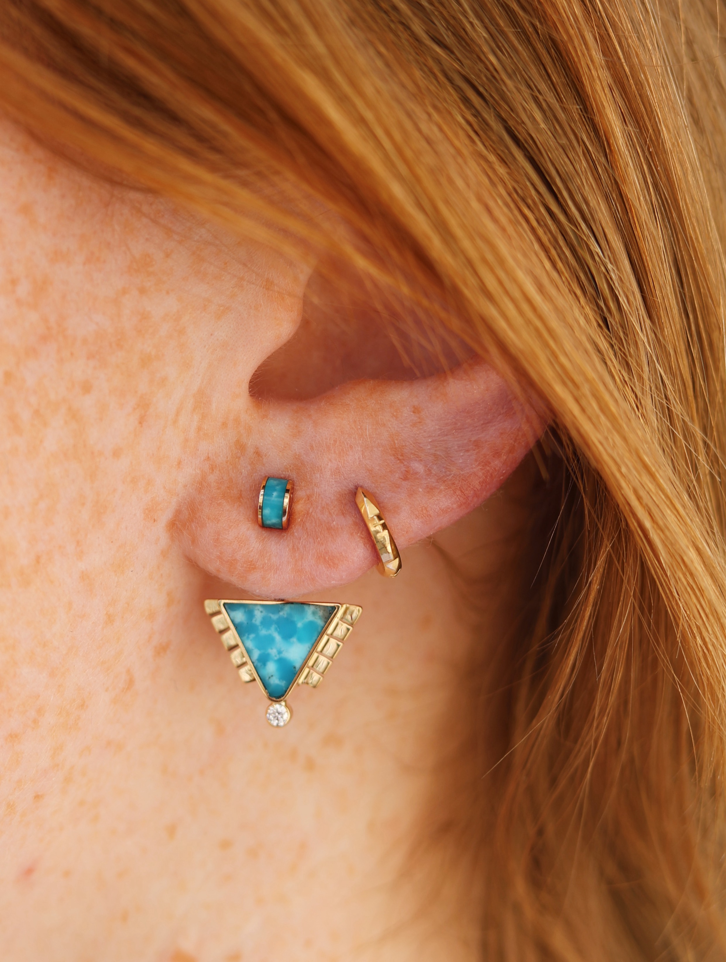Triangle ear jackets that are inlaid with Water Web Turquoise and feature our 