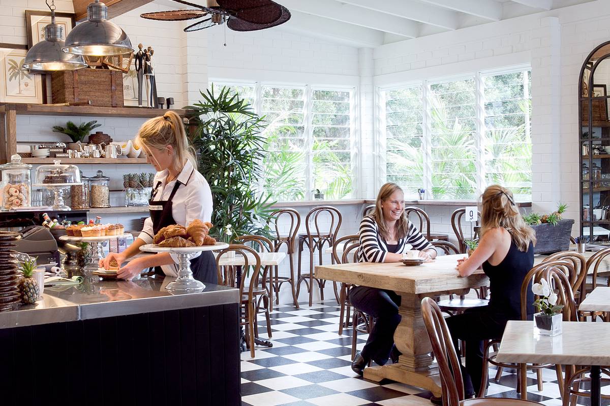 Customers enjoy a coffee and chat inside our stunning cafe at the Alfresco Emporium flagship store in Collaroy.