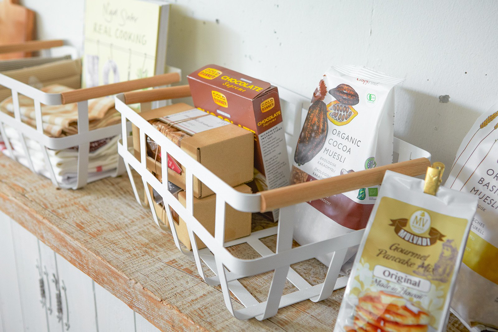 Yamazaki Home Storage Basket holding packaged foods. 