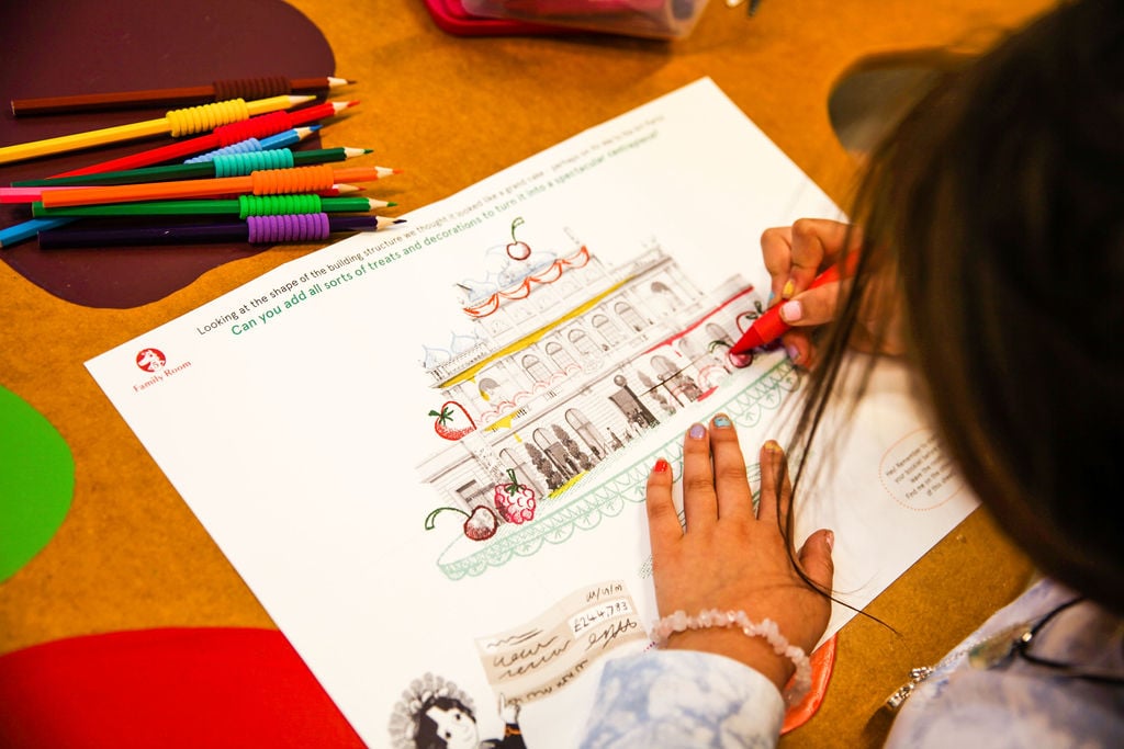 A child drawing on the Activity Trail 