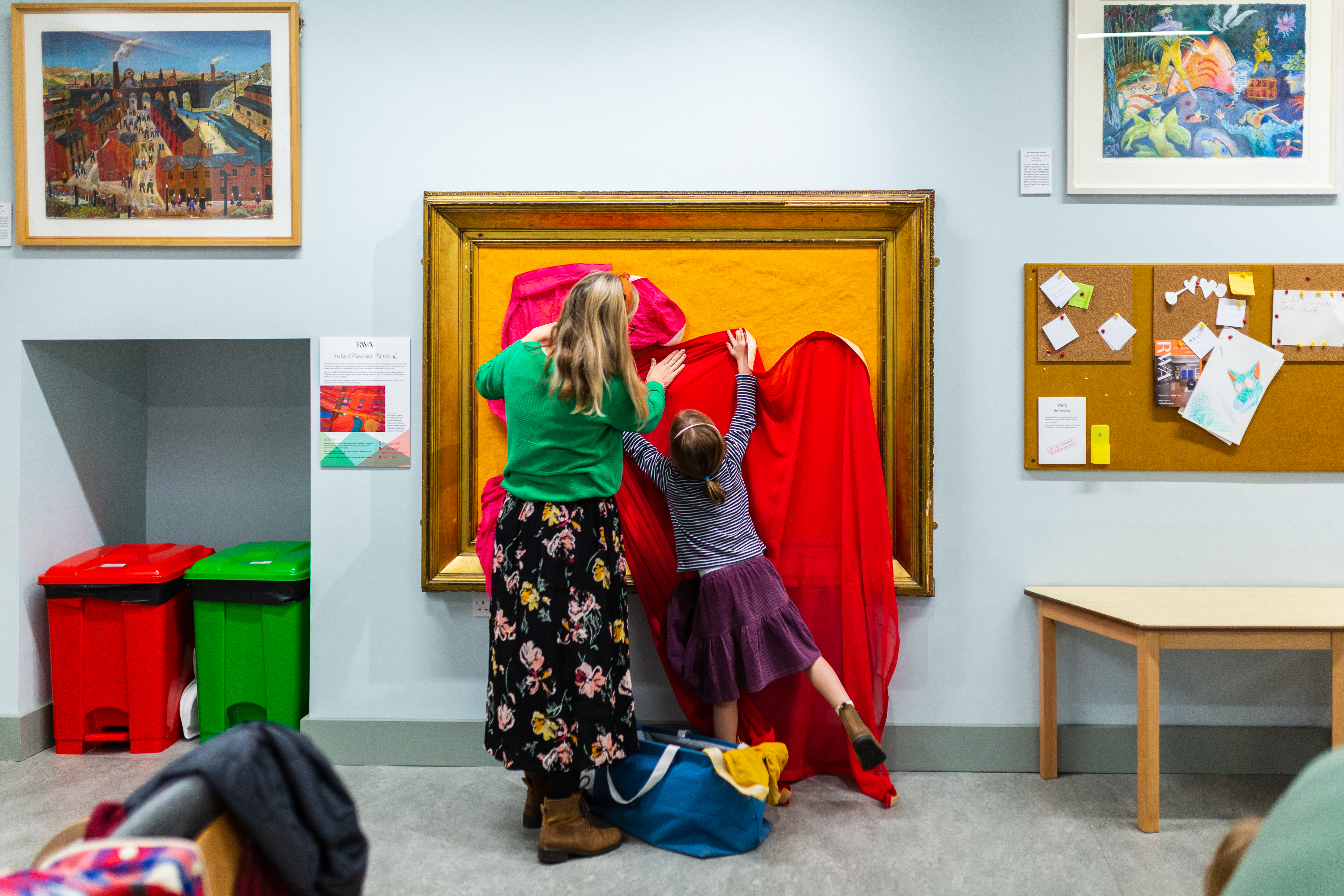 A woman and child playing together with velcro fabric in the RWA Family Activity Space 