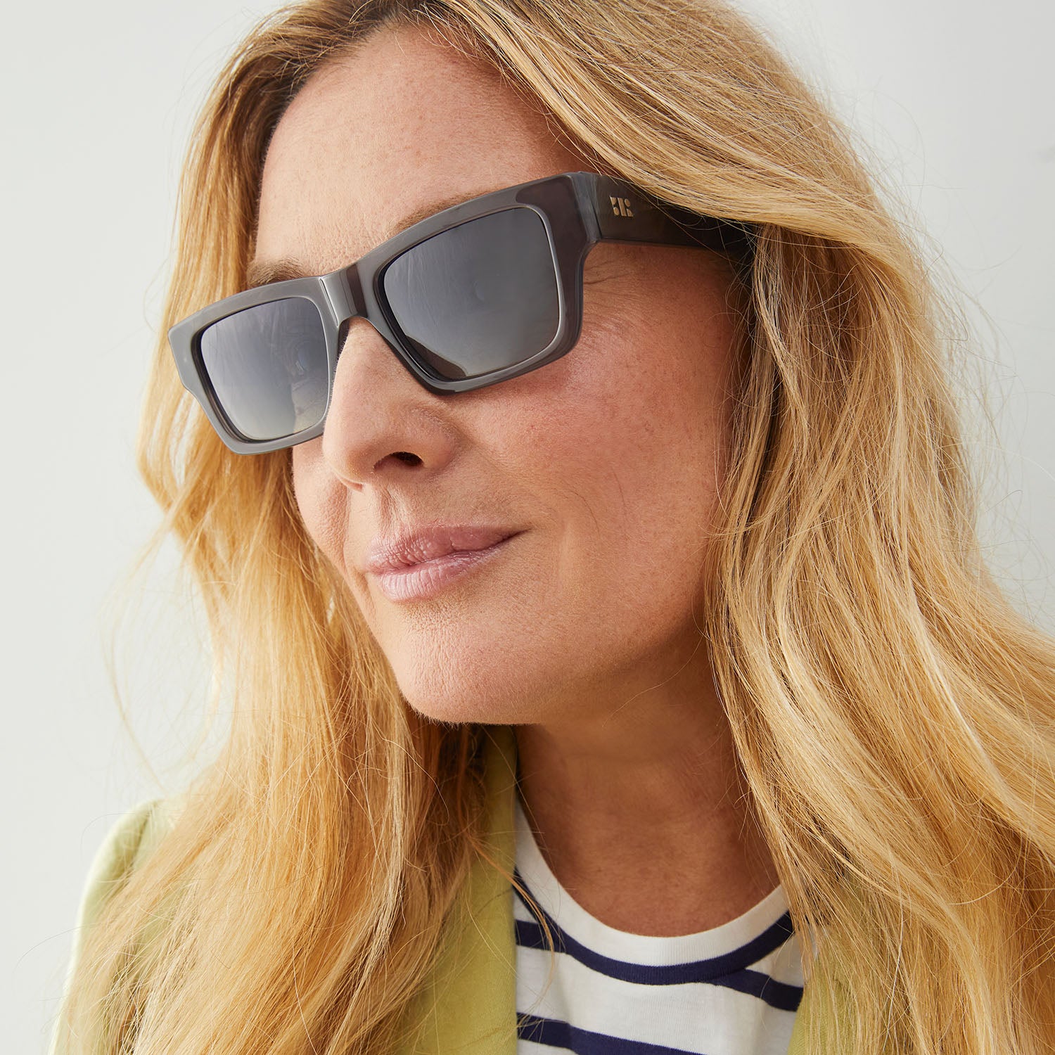 Photo of a man or woman wearing Aimé Sun Clear Dark olive Sun Glasses by French Kiwis