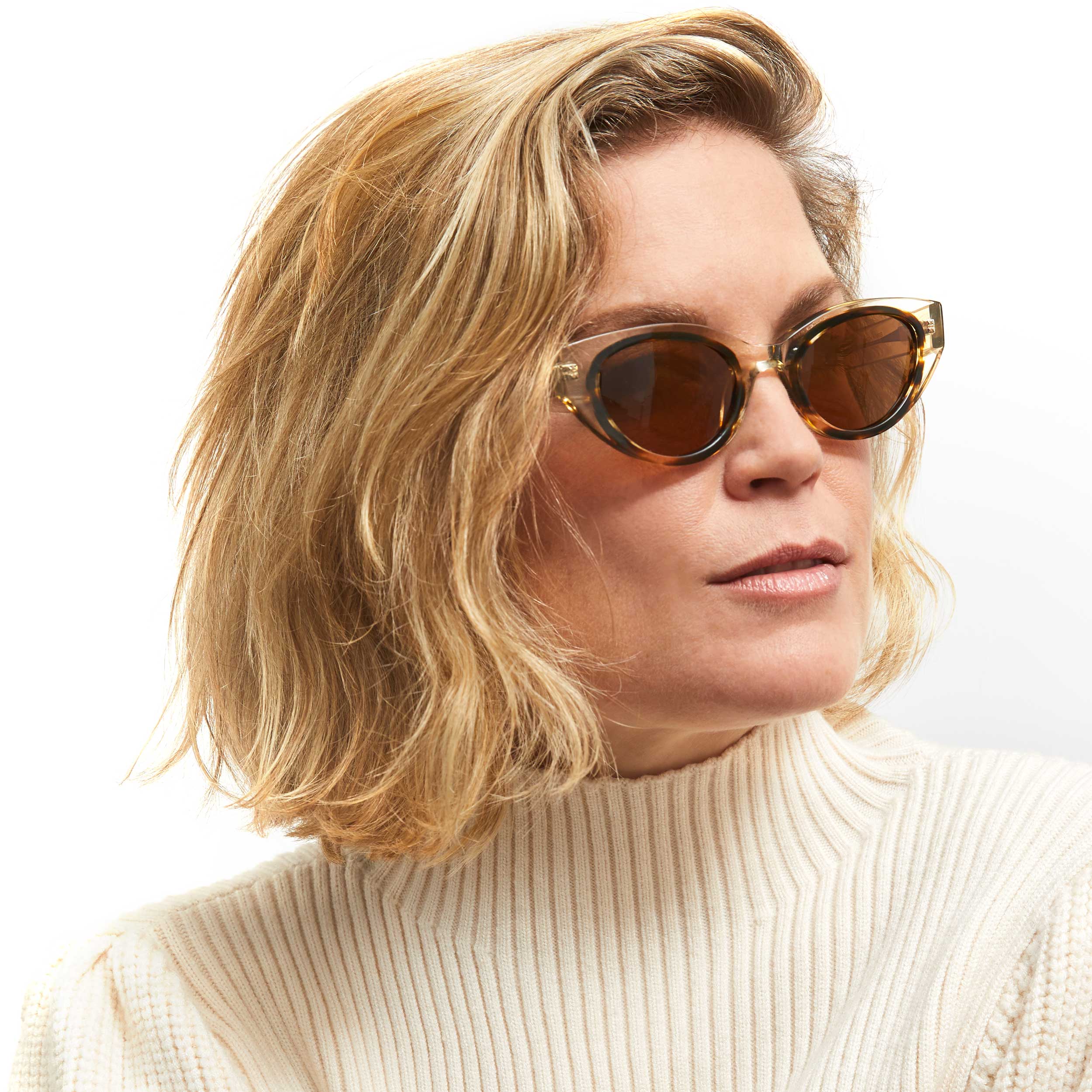 Photo of a man or woman wearing Camille Sun Havana Tortoise Sun Glasses by French Kiwis