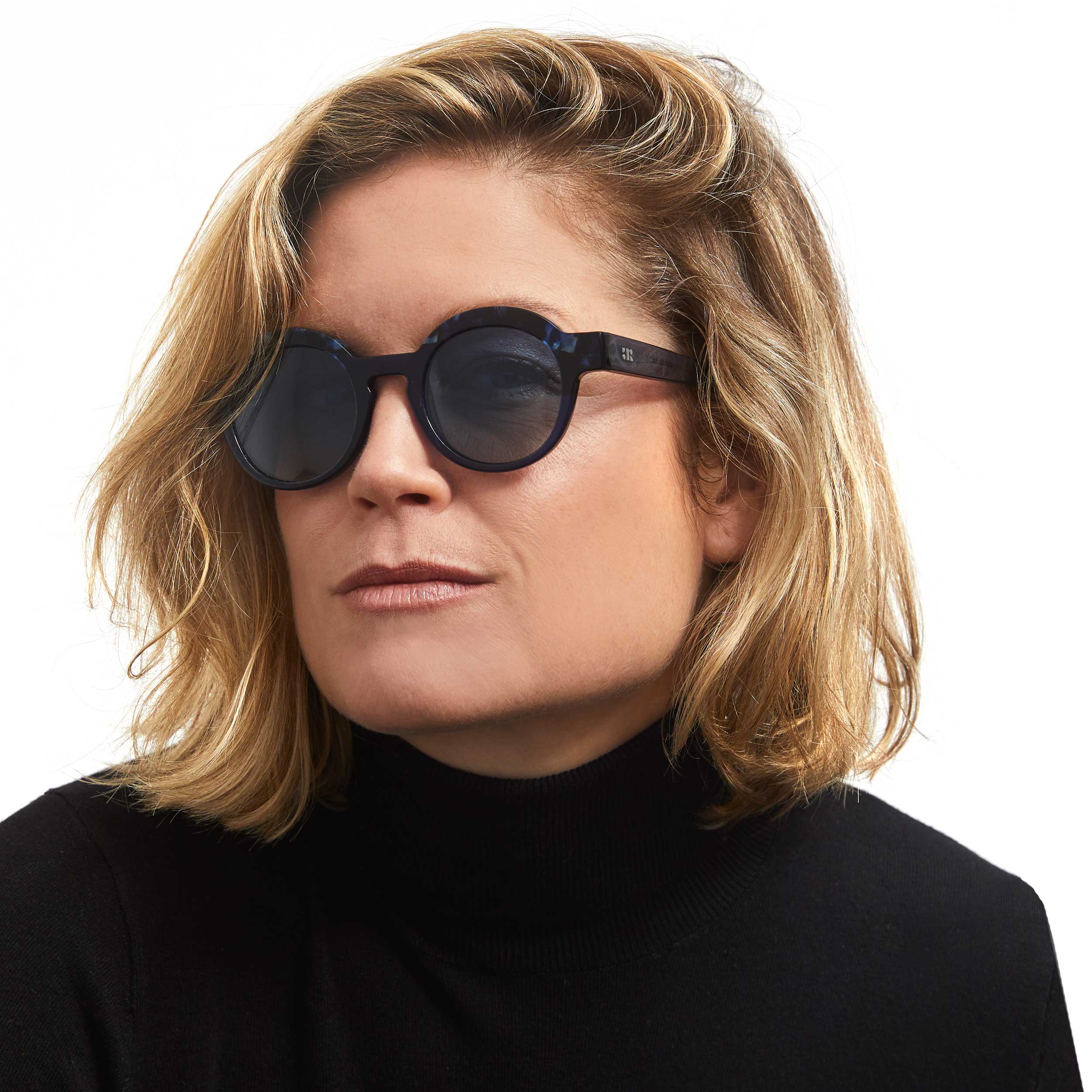 Photo of a man or woman wearing Charlotte Sun Clear Burgundy & Blue Marble Sun Glasses by French Kiwis