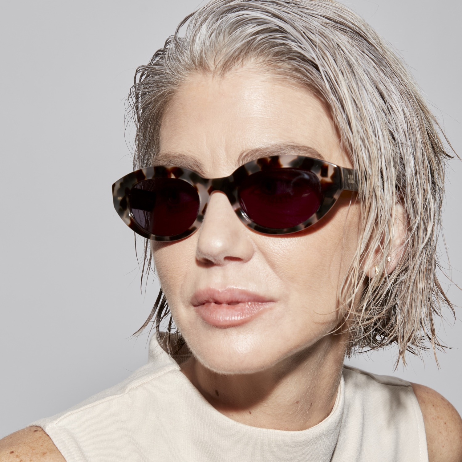 Photo of a man or woman wearing Monroe Sun Sand Sun Glasses by French Kiwis