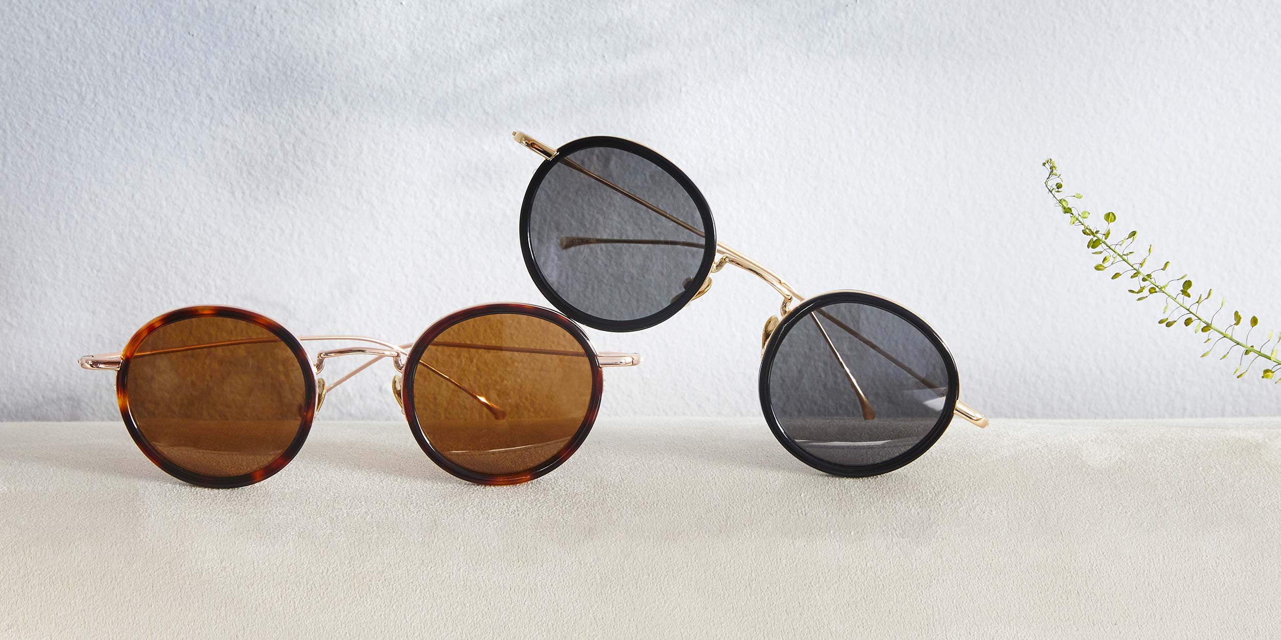 Photo Details of Nicolas Sun Dark Red & Gold Sun Glasses in a room