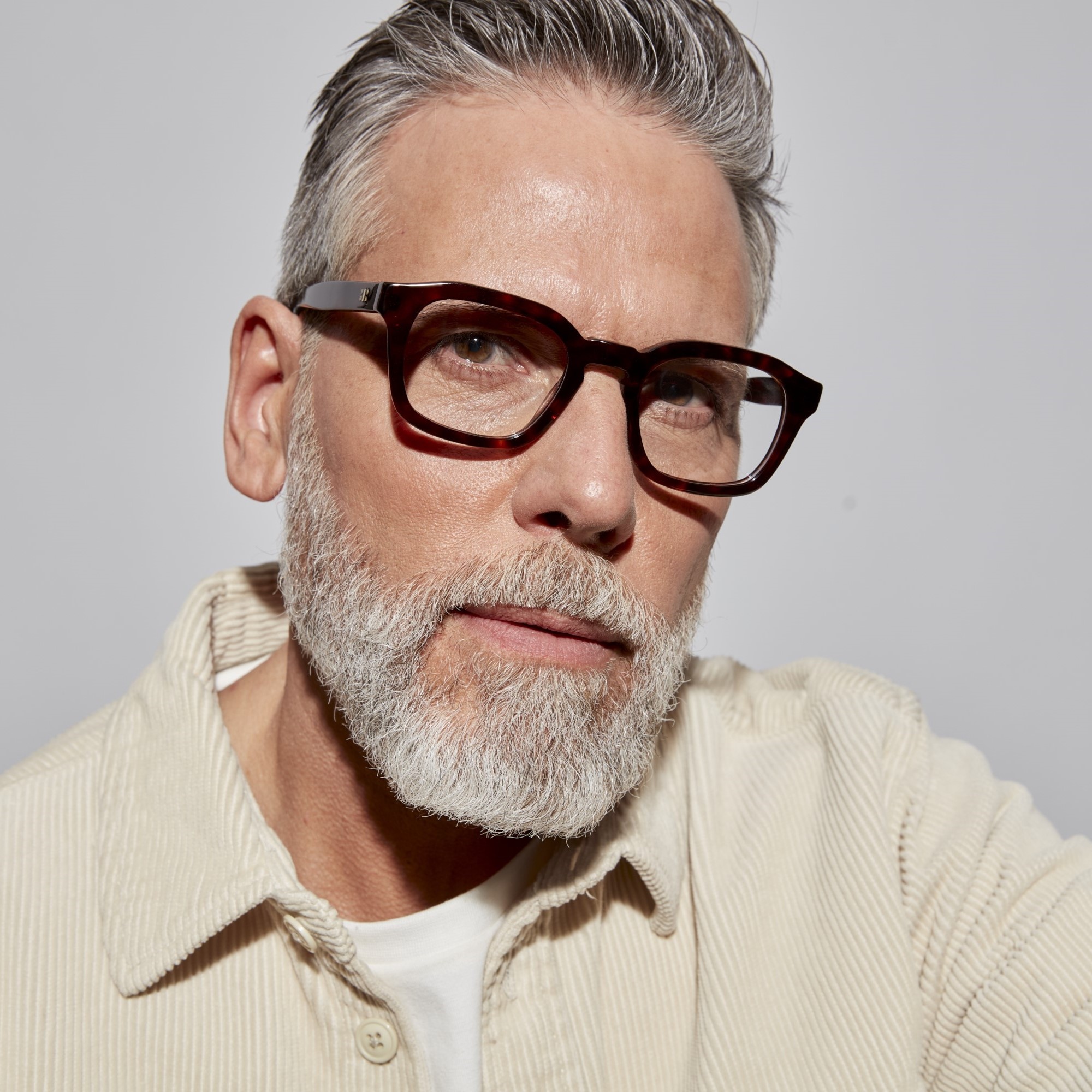 Photo of a man or woman wearing Oscar Clear Dark Olive Reading Glasses by French Kiwis