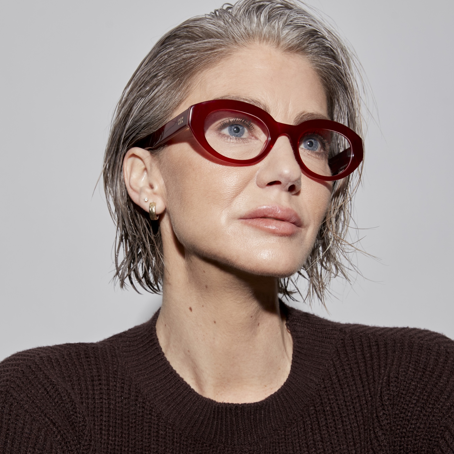 Photo of a man or woman wearing Monroe Blue Light Sand Blue Light Glasses by French Kiwis