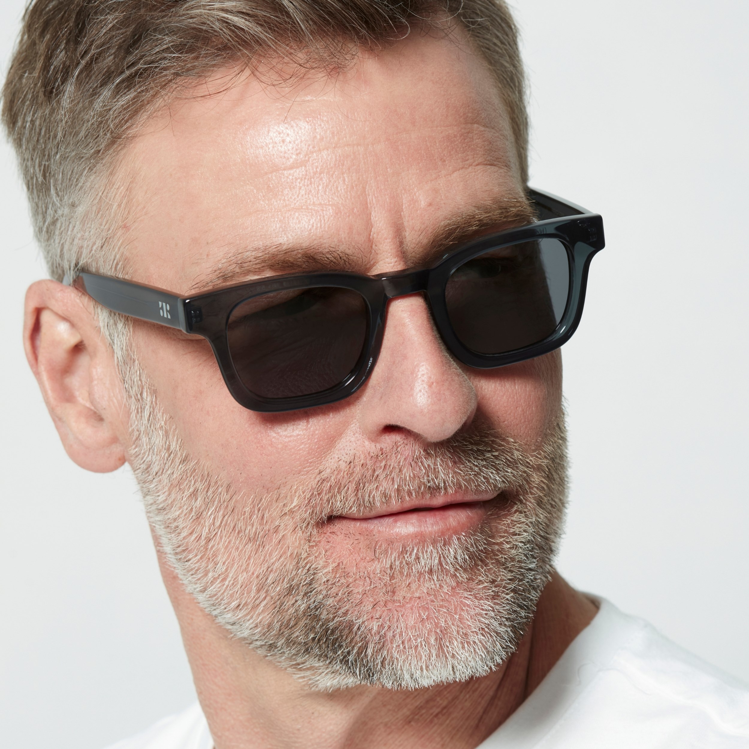 Photo of a man or woman wearing Émile Sun Army Green Sun Glasses by French Kiwis