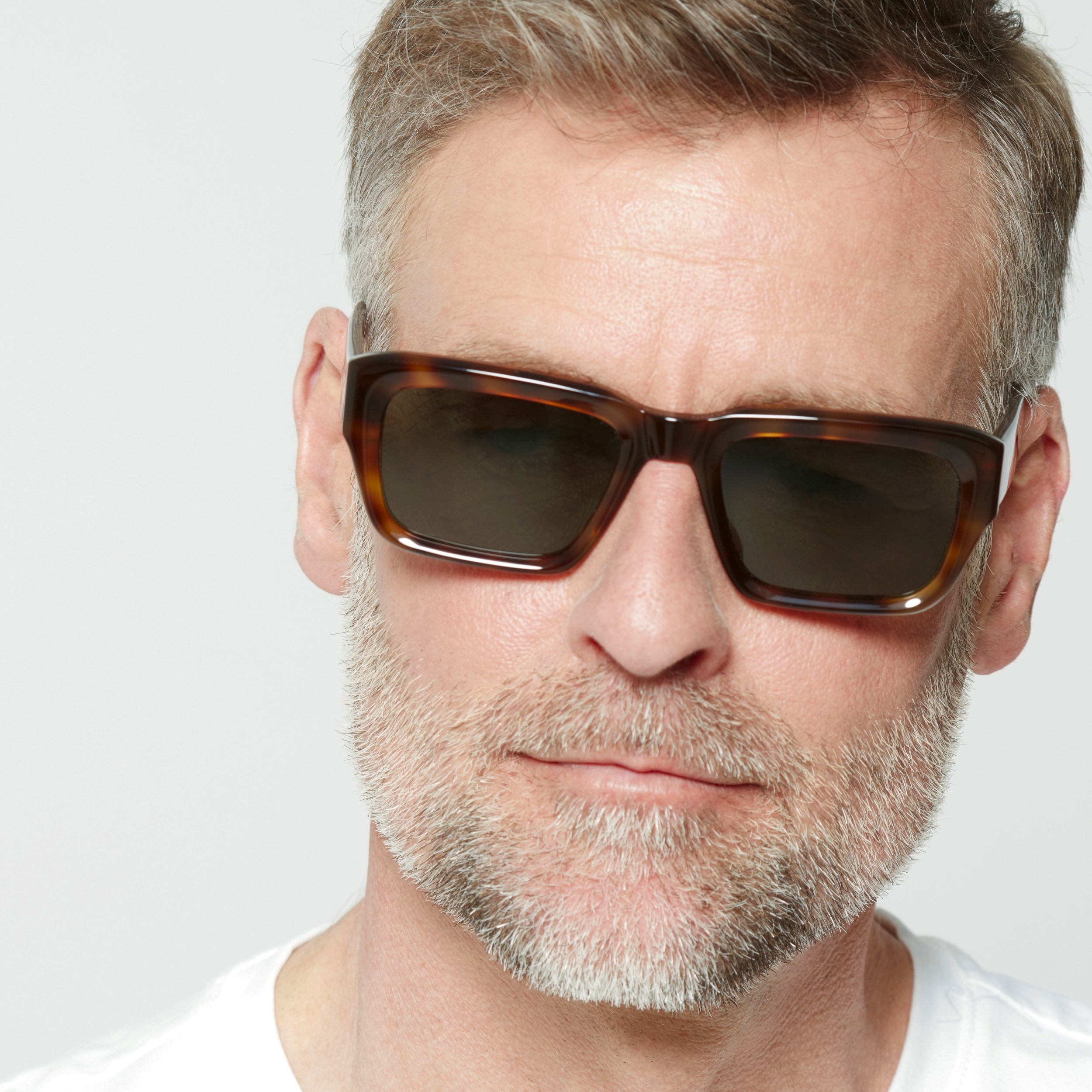 Photo of a man or woman wearing Henri Sun Clear Dark Olive Sun Glasses by French Kiwis