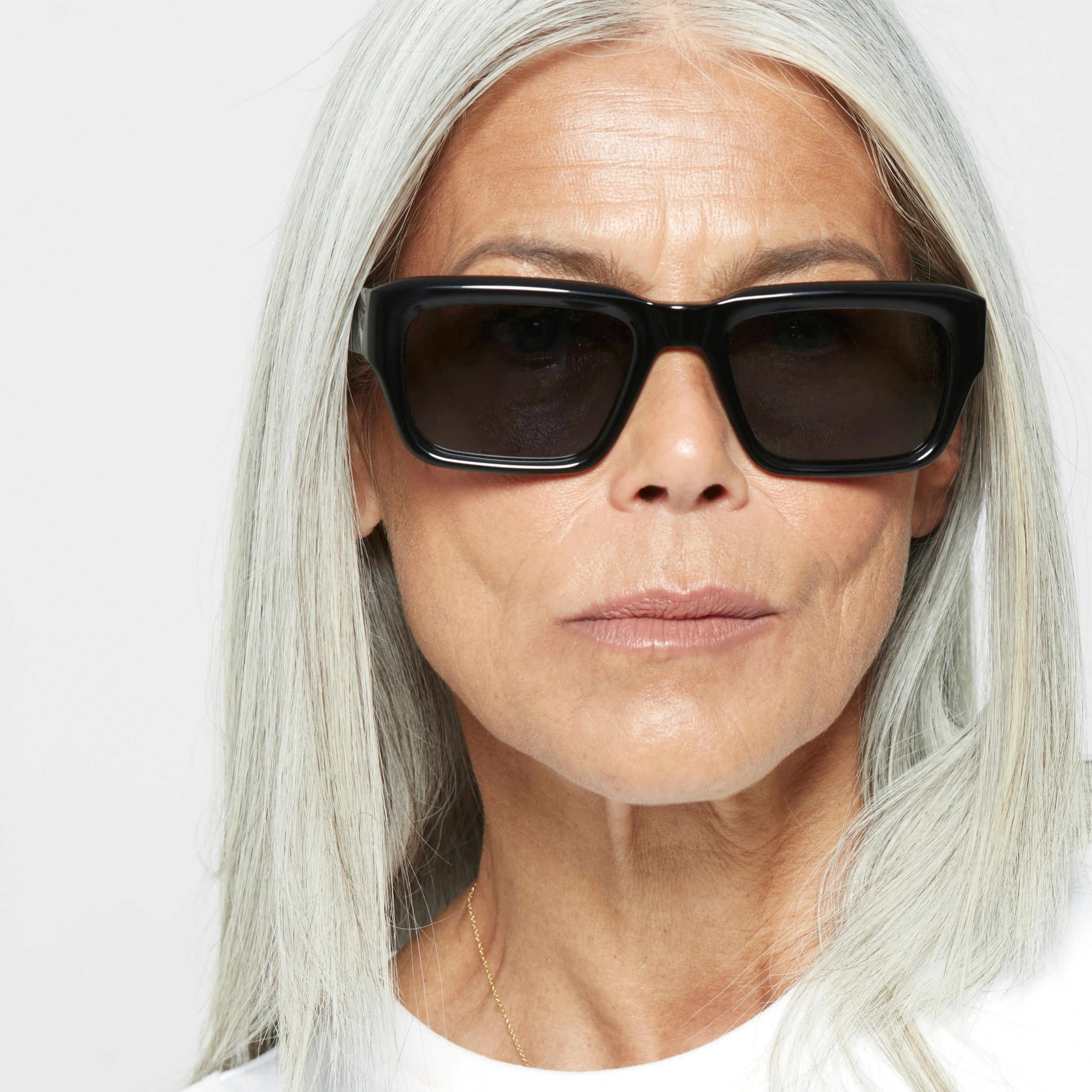Photo of a man or woman wearing Henri Sun Clear Dark Olive Sun Glasses by French Kiwis