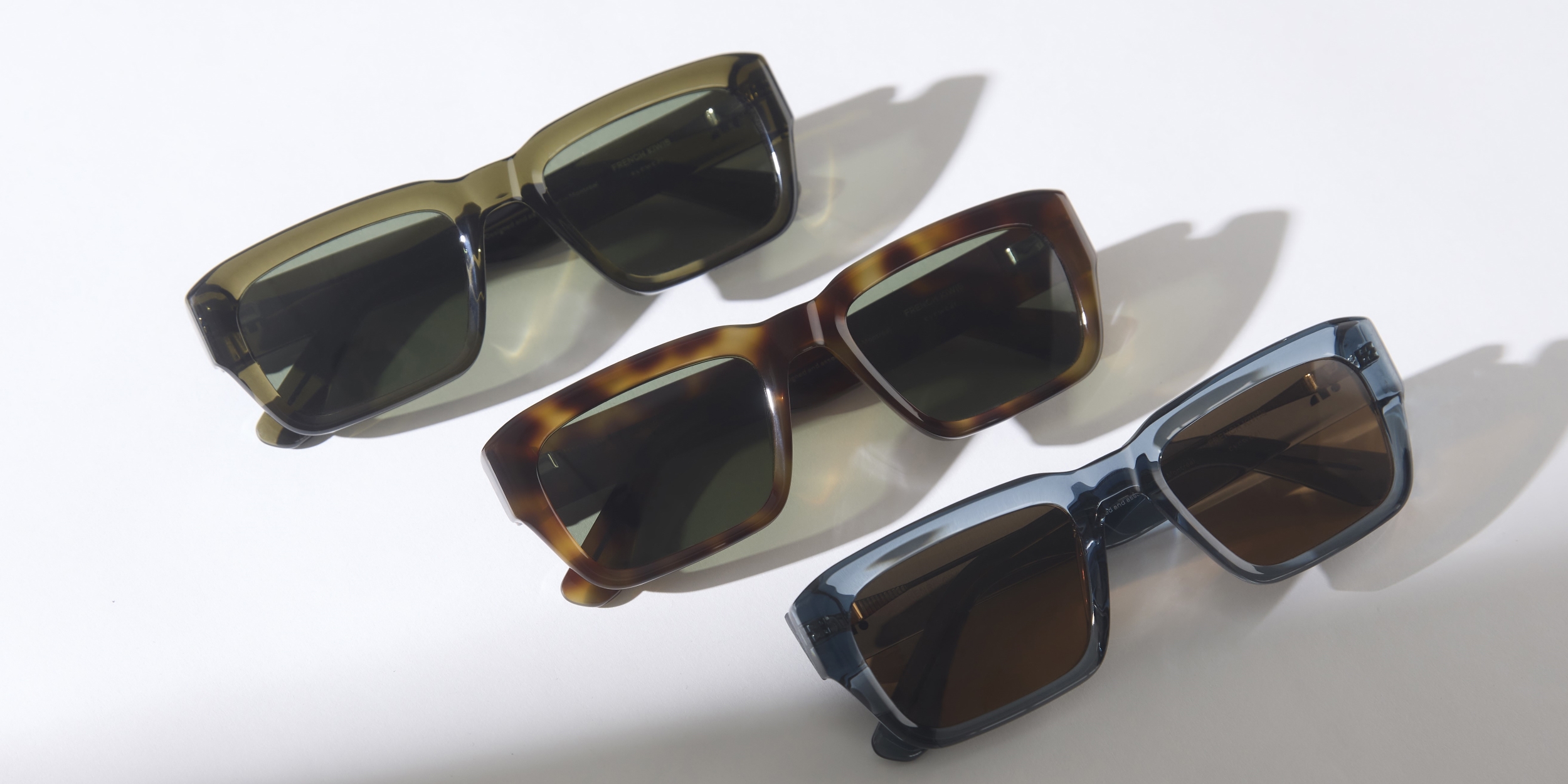 Photo Details of Henri Sun Clear Stone Blue Sun Glasses in a room