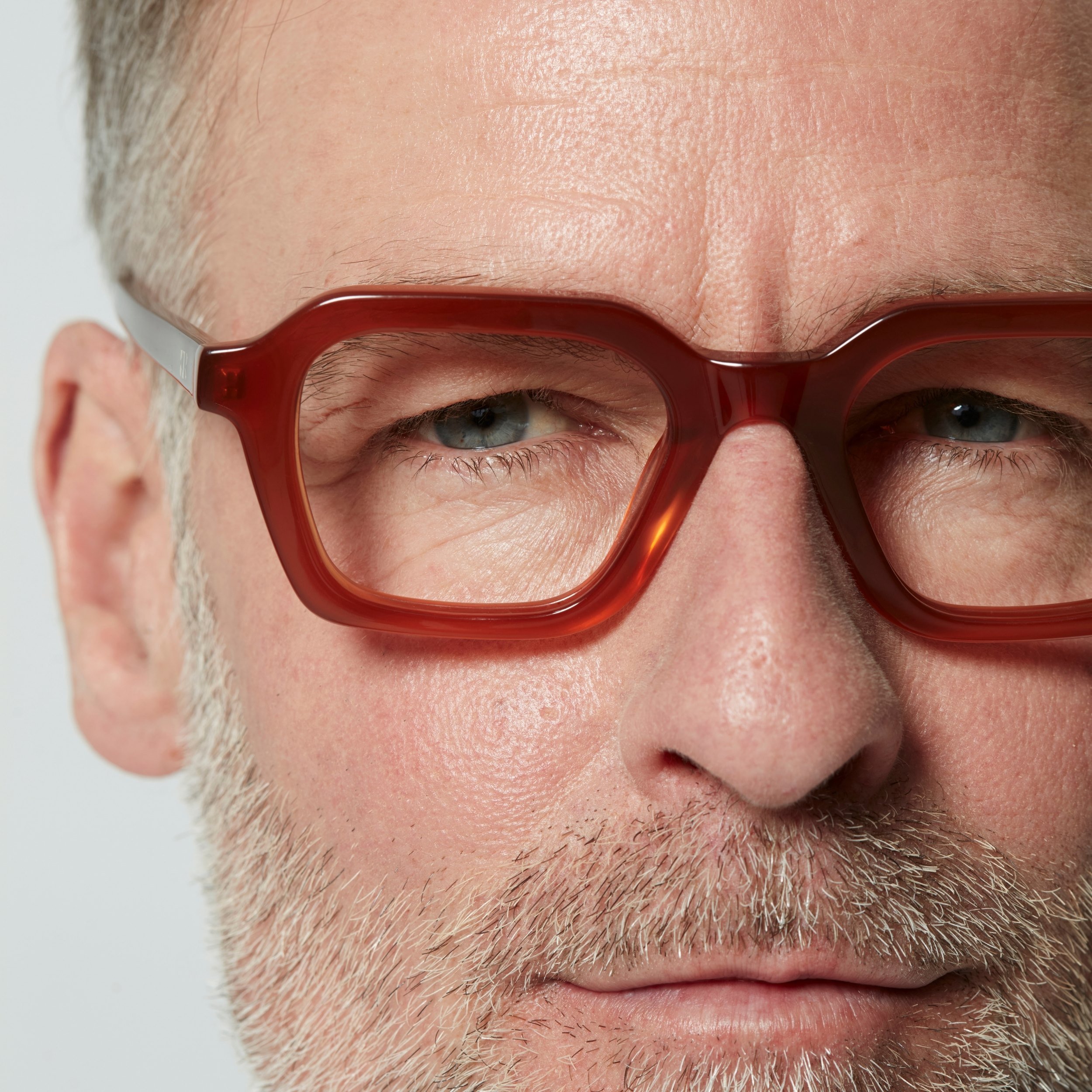 Photo of a man or woman wearing Lennox Blue Light Clear Burgundy Blue Light Glasses by French Kiwis