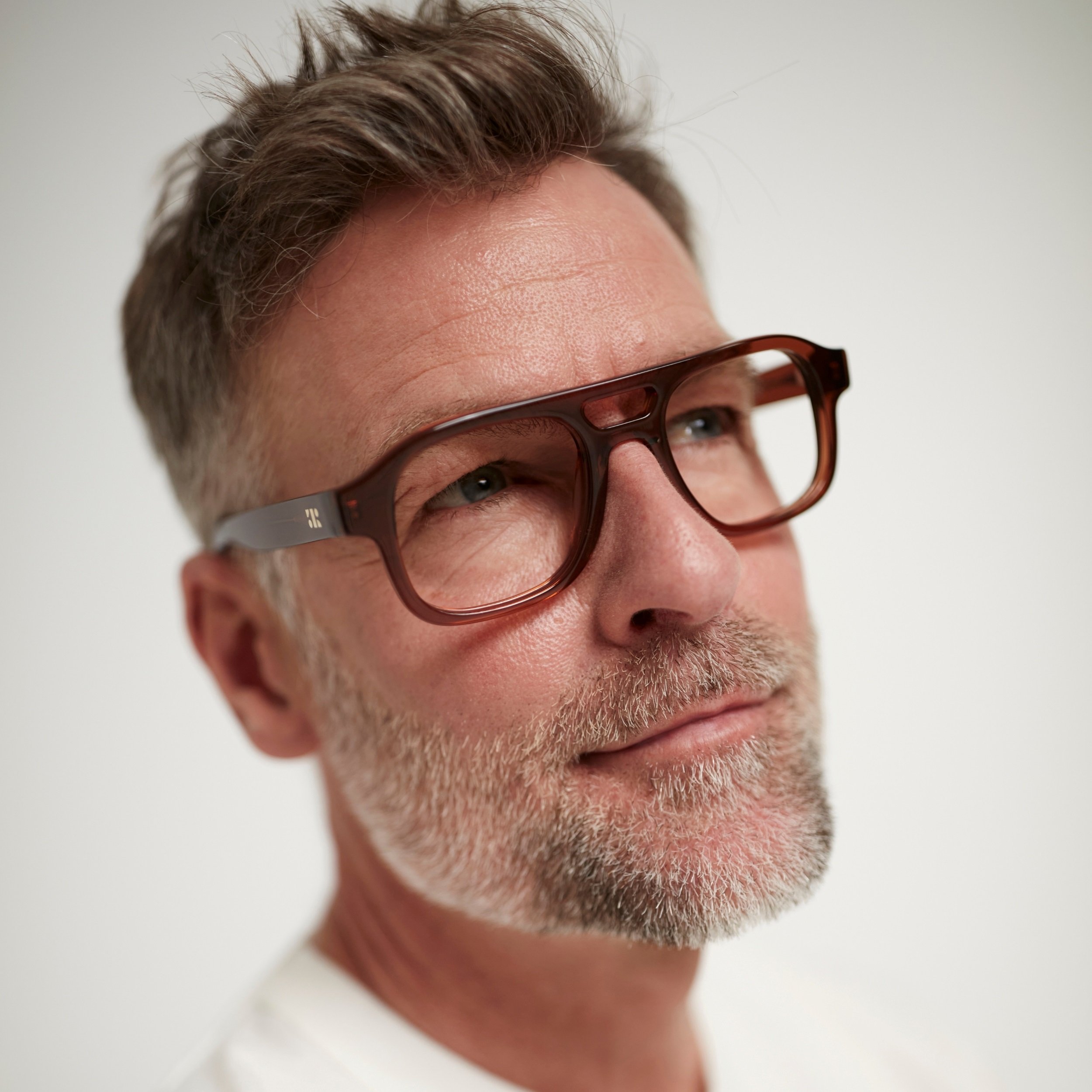 Photo of a man or woman wearing Lenny Clear Stone Blue Reading Glasses by French Kiwis
