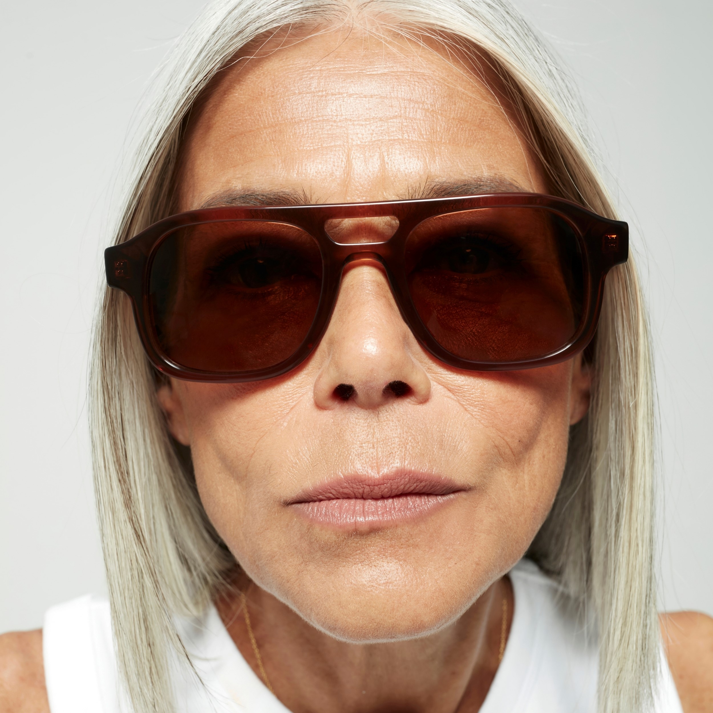 Photo of a man or woman wearing Lenny Sun Clear Brown Sun Glasses by French Kiwis