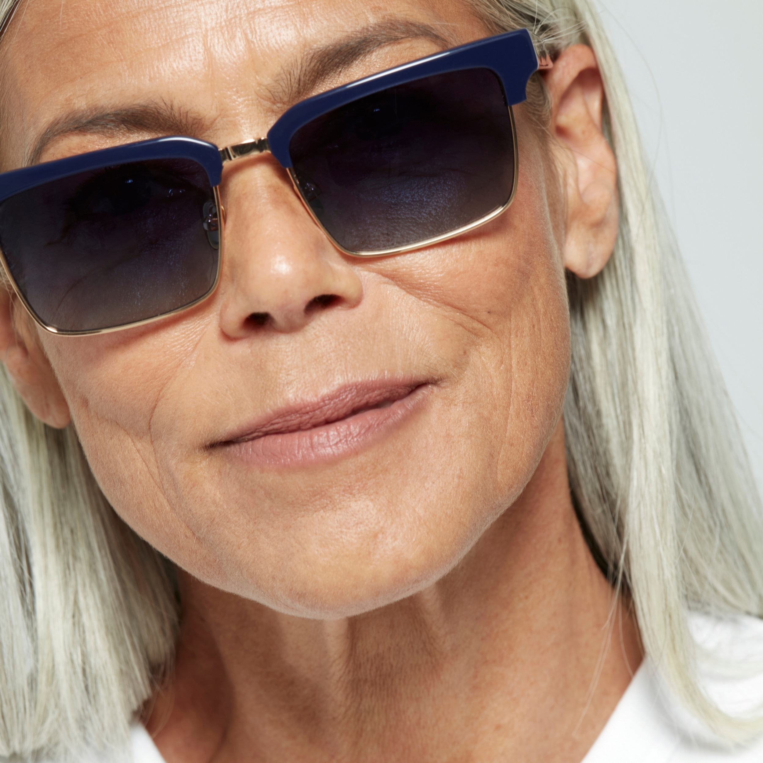 Photo of a man or woman wearing Paris Sun Red & Gold Sun Glasses by French Kiwis