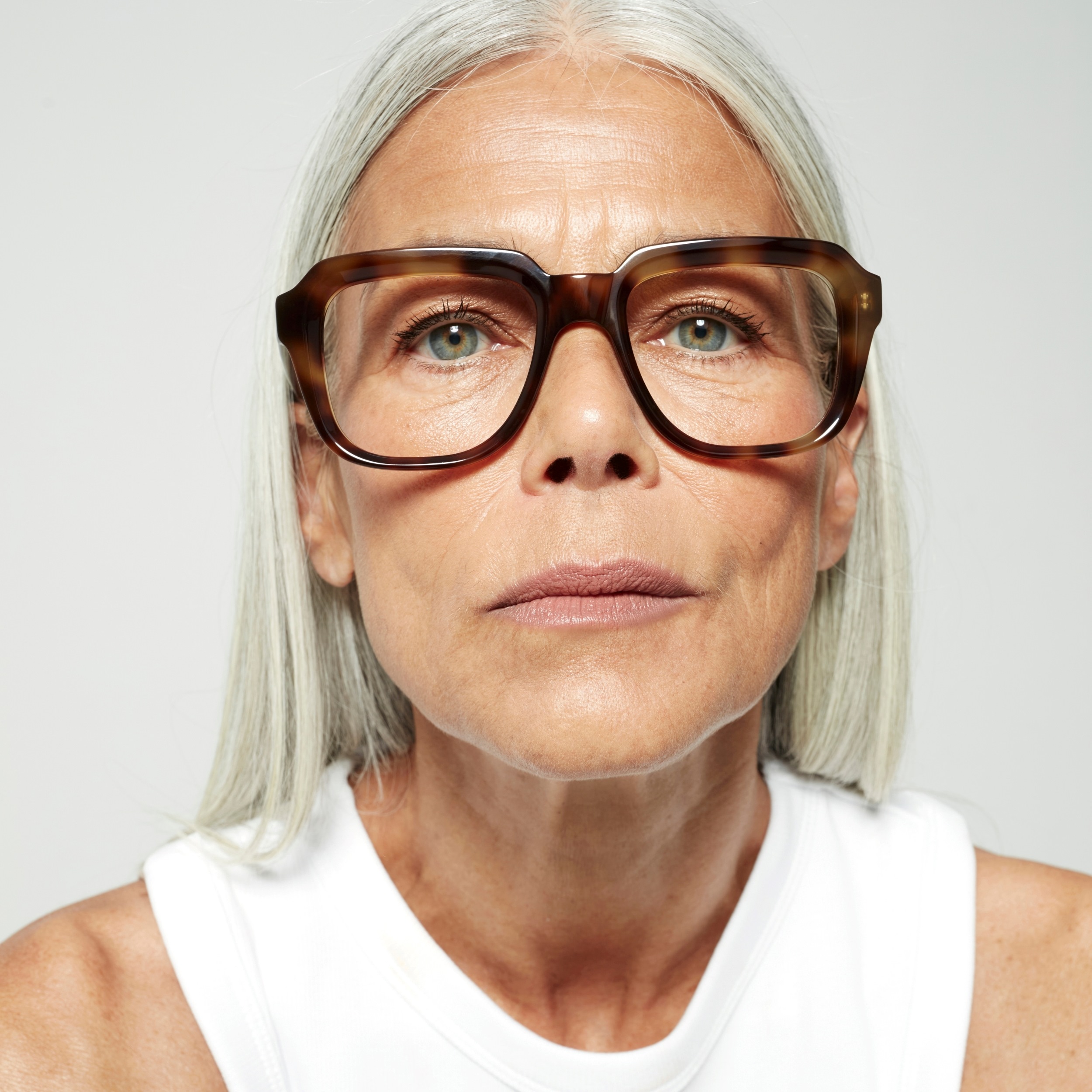 Photo of a man or woman wearing Reuben Clear Taupe Reading Glasses by French Kiwis