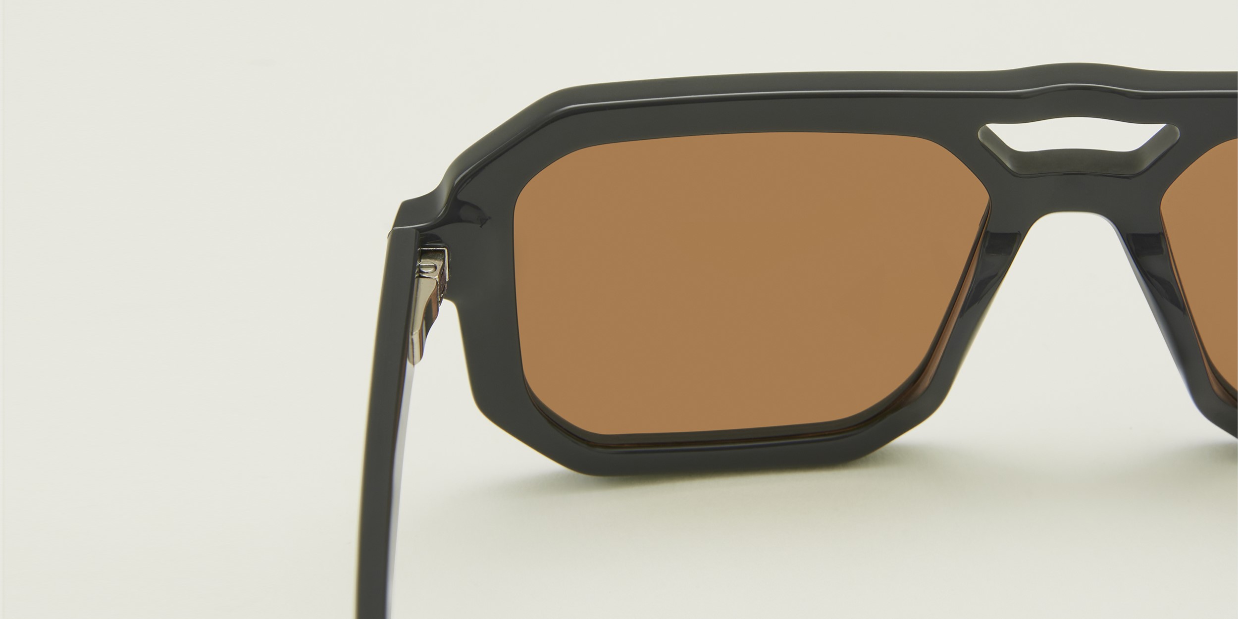 Photo Details of Angelo Sun Tortoise Sun Glasses in a room