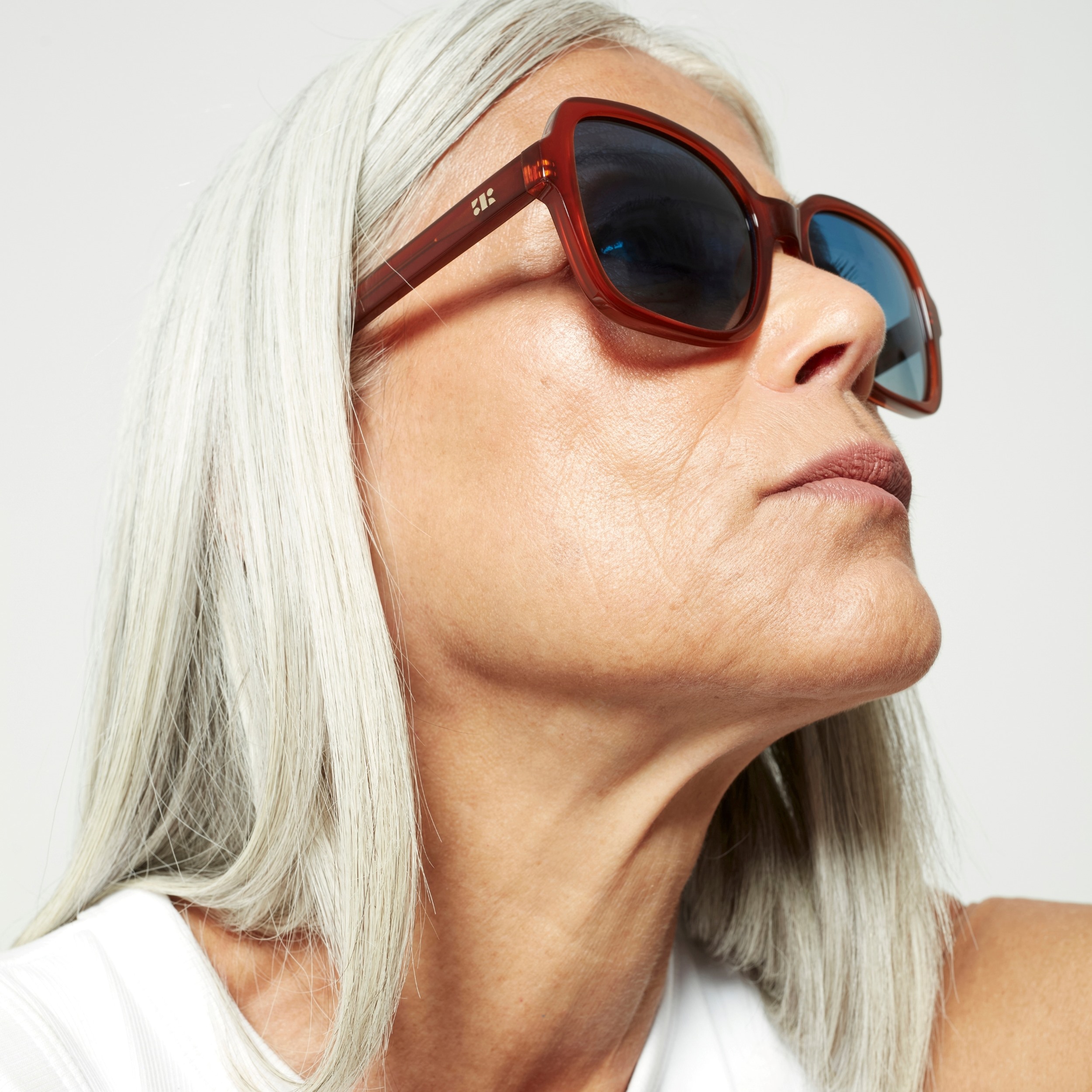 Photo of a man or woman wearing Ella Sun Clear Burgundy Sun Glasses by French Kiwis